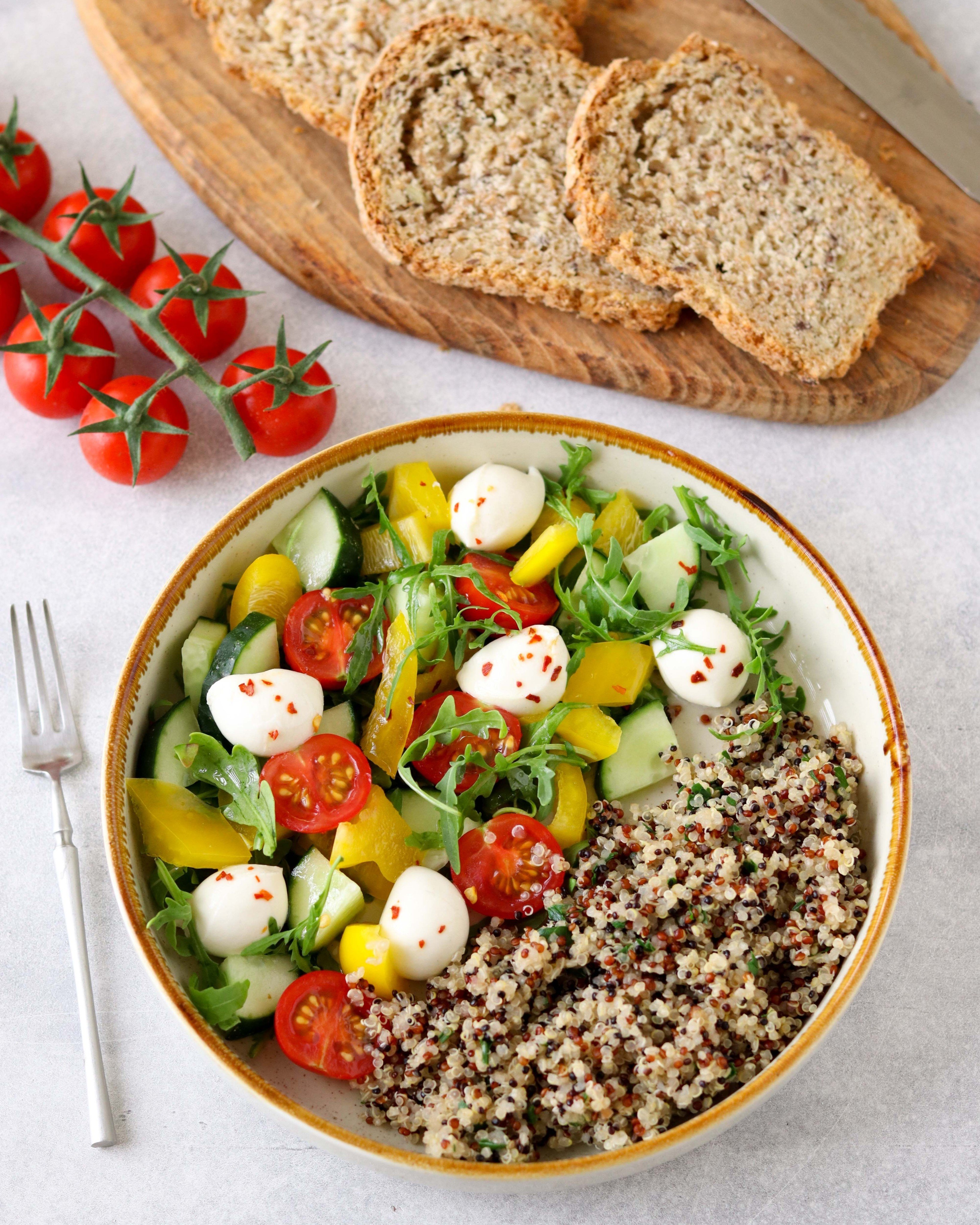 Quinoa, bell pepper, cucumber, arugula, cherry tomatoes, and mozzarella. Photo: Shutterstock