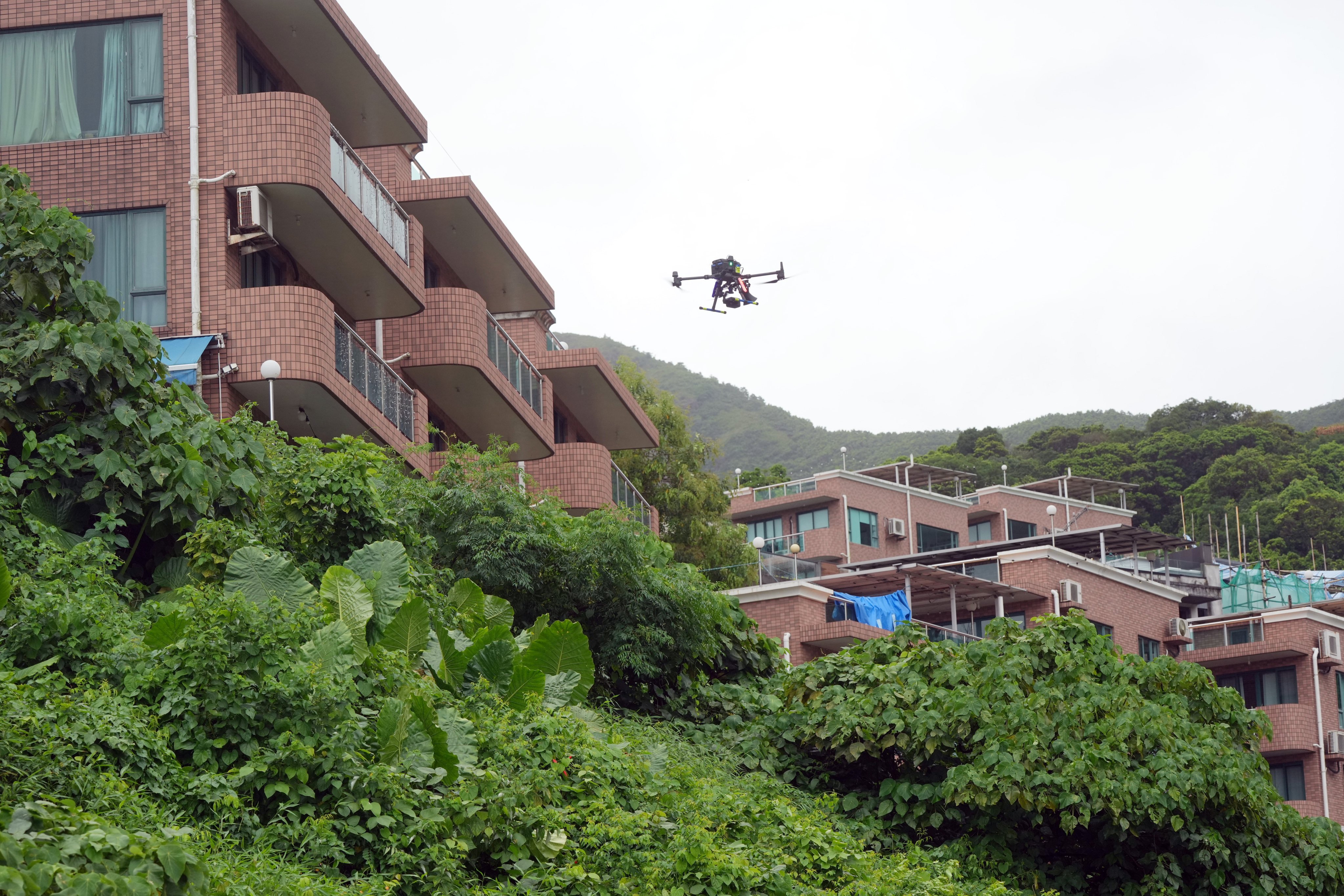 Police conduct a demonstration of the use of drones to catch burglars hiding in rural areas. Photo: May Tse