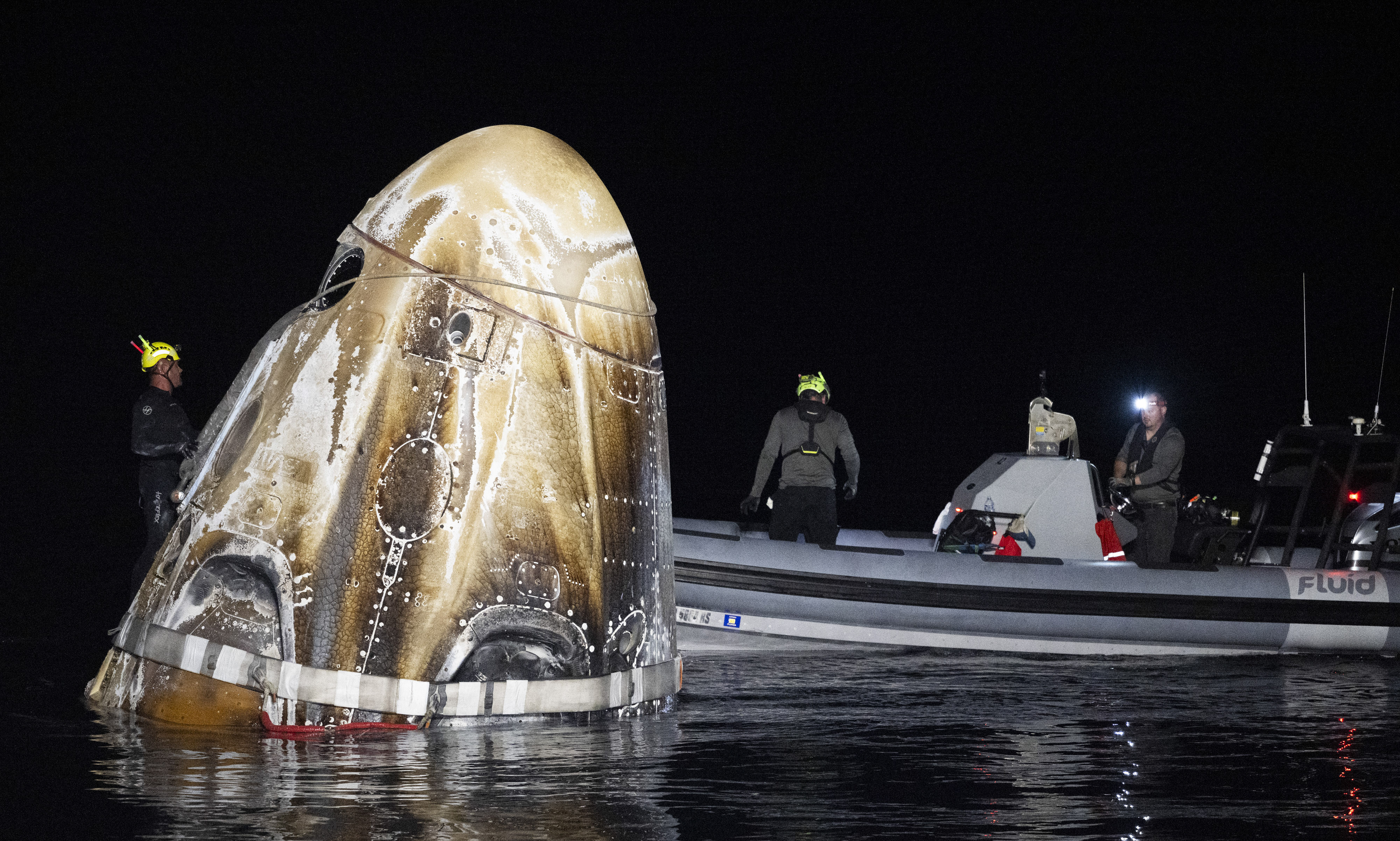 Support teams work around the SpaceX Dragon Endeavour spacecraft shortly after it landed in the Gulf of Mexico off the coast of Pensacola, Florida, on Friday. Photo: Nasa via AP