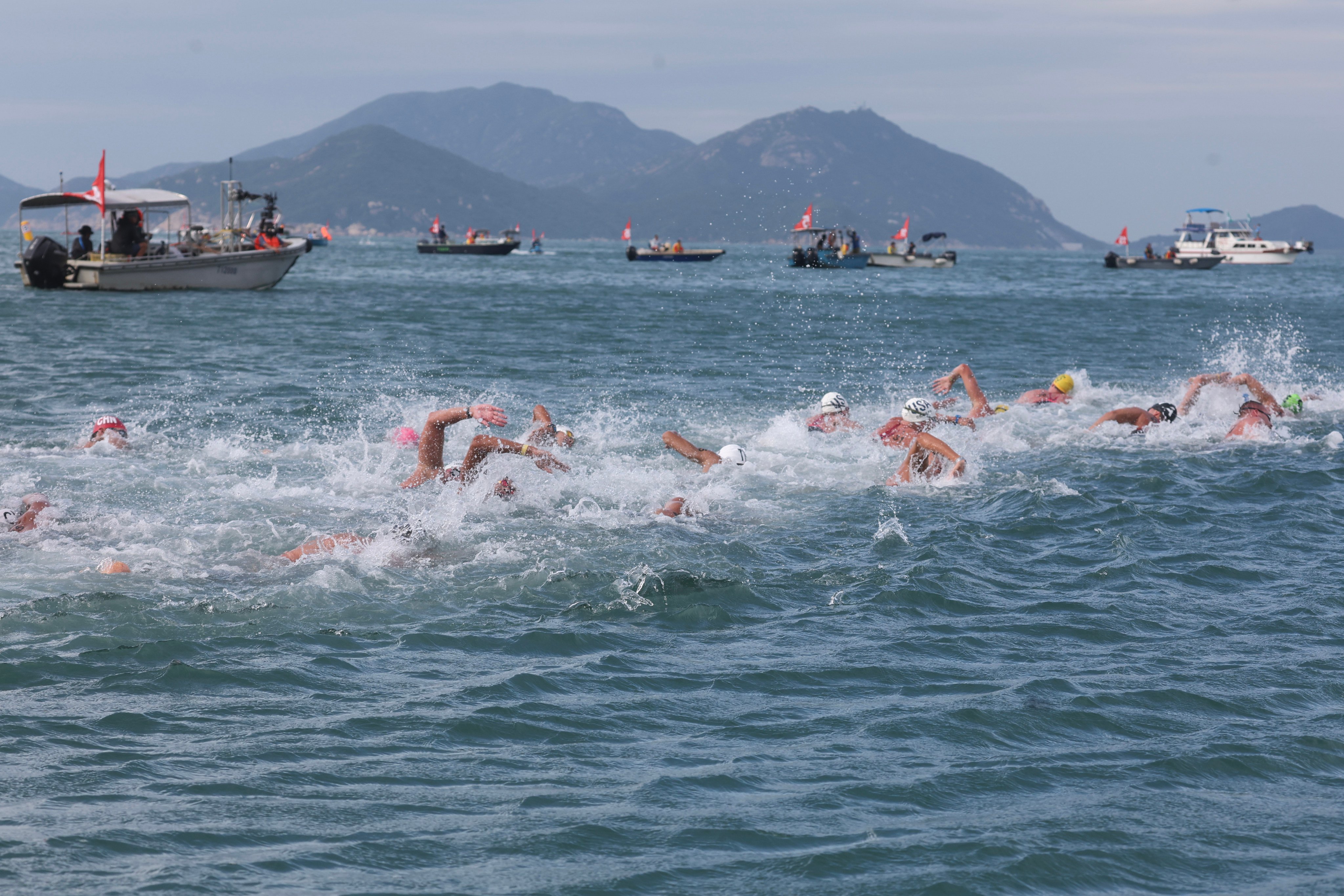 Athletes battled choppy seas and increasingly windy conditions during the  in the World Aquatics Open Water Swimming World Cup event in Hong Kong. Photo: Edmond So