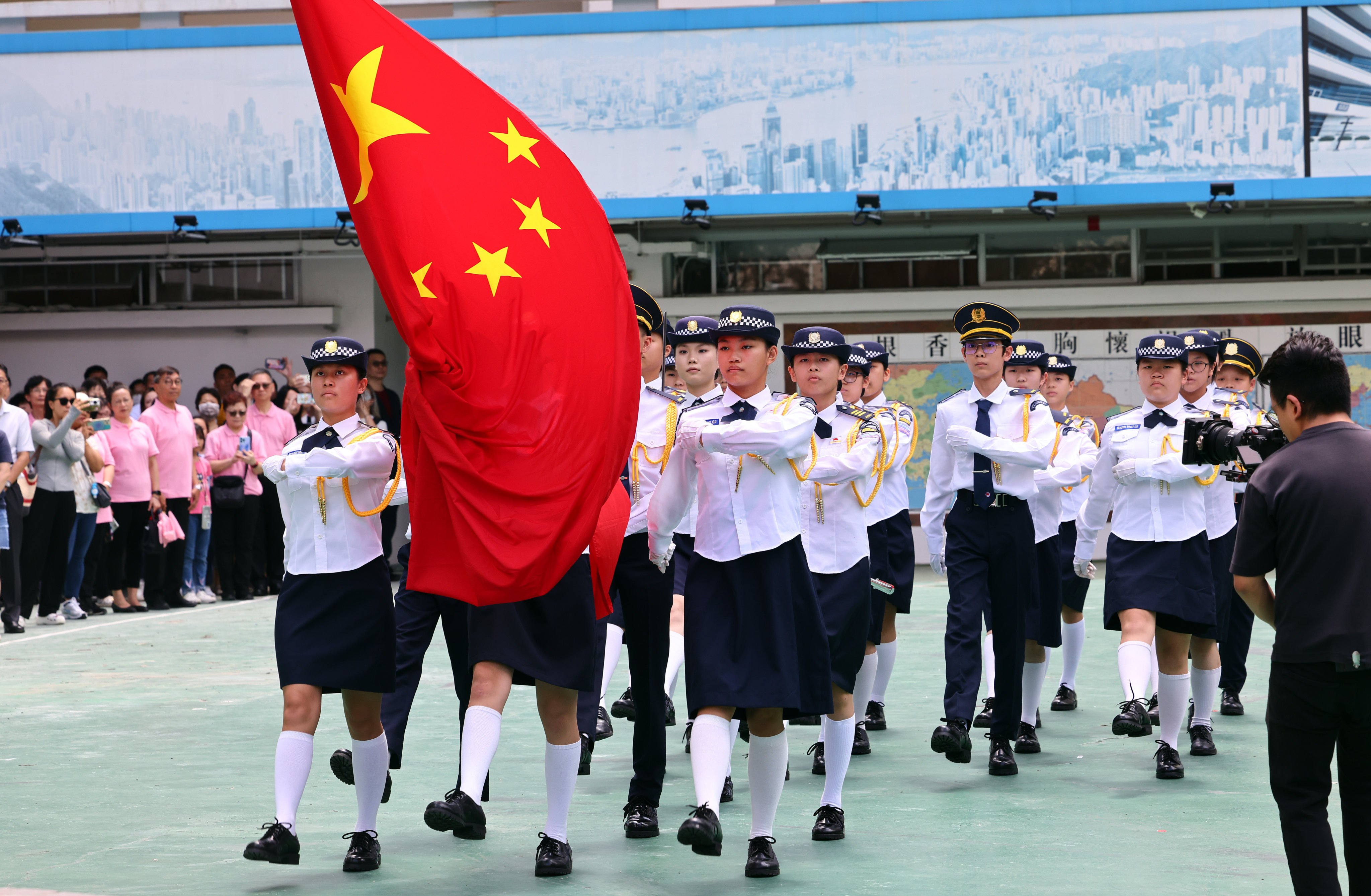 Young people participate in a flag-raising ceremony in Sha Tin. Photo: Dickson Lee