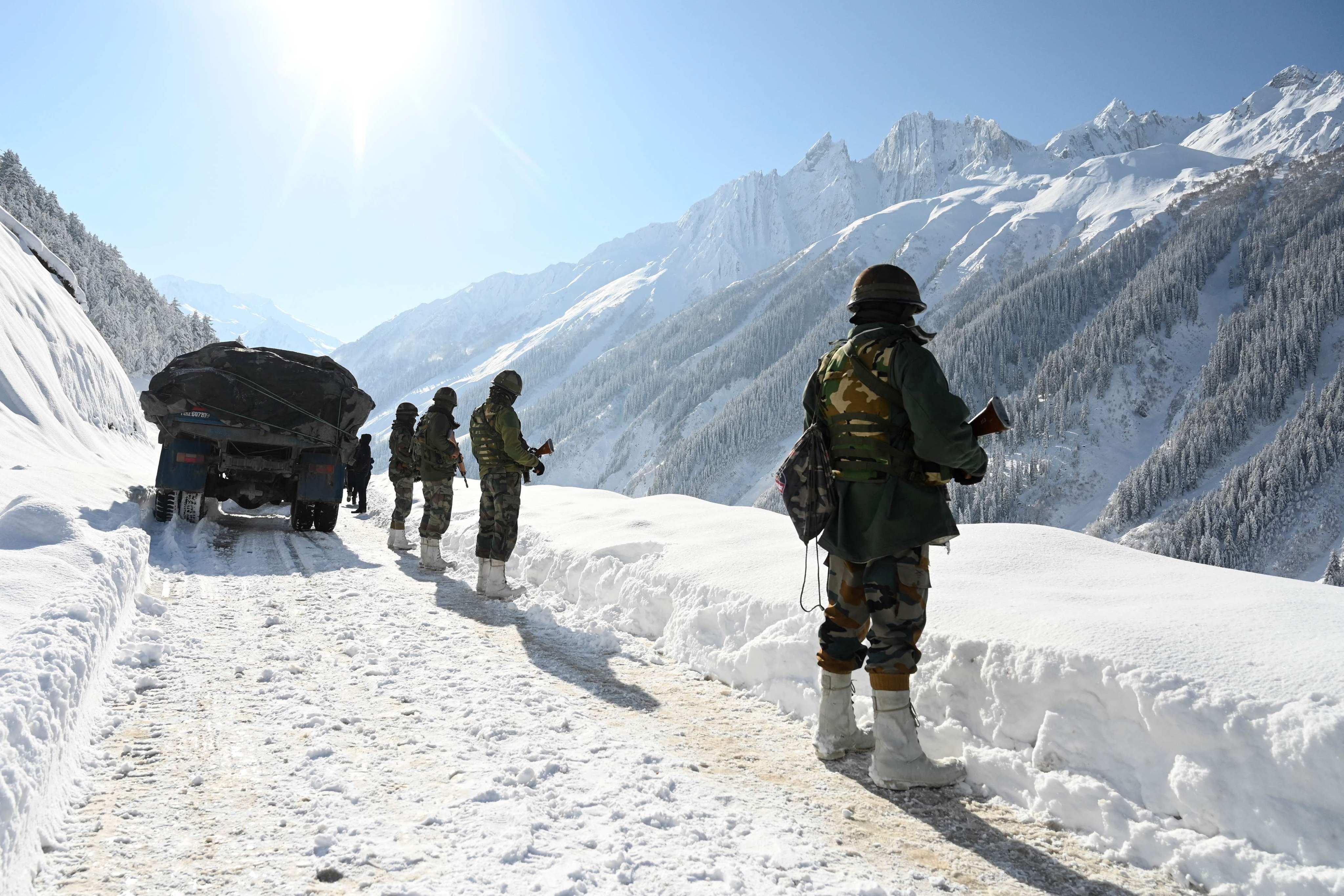 Indian army soldiers are seen on a road bordering China in February 2021. Photo: AFP