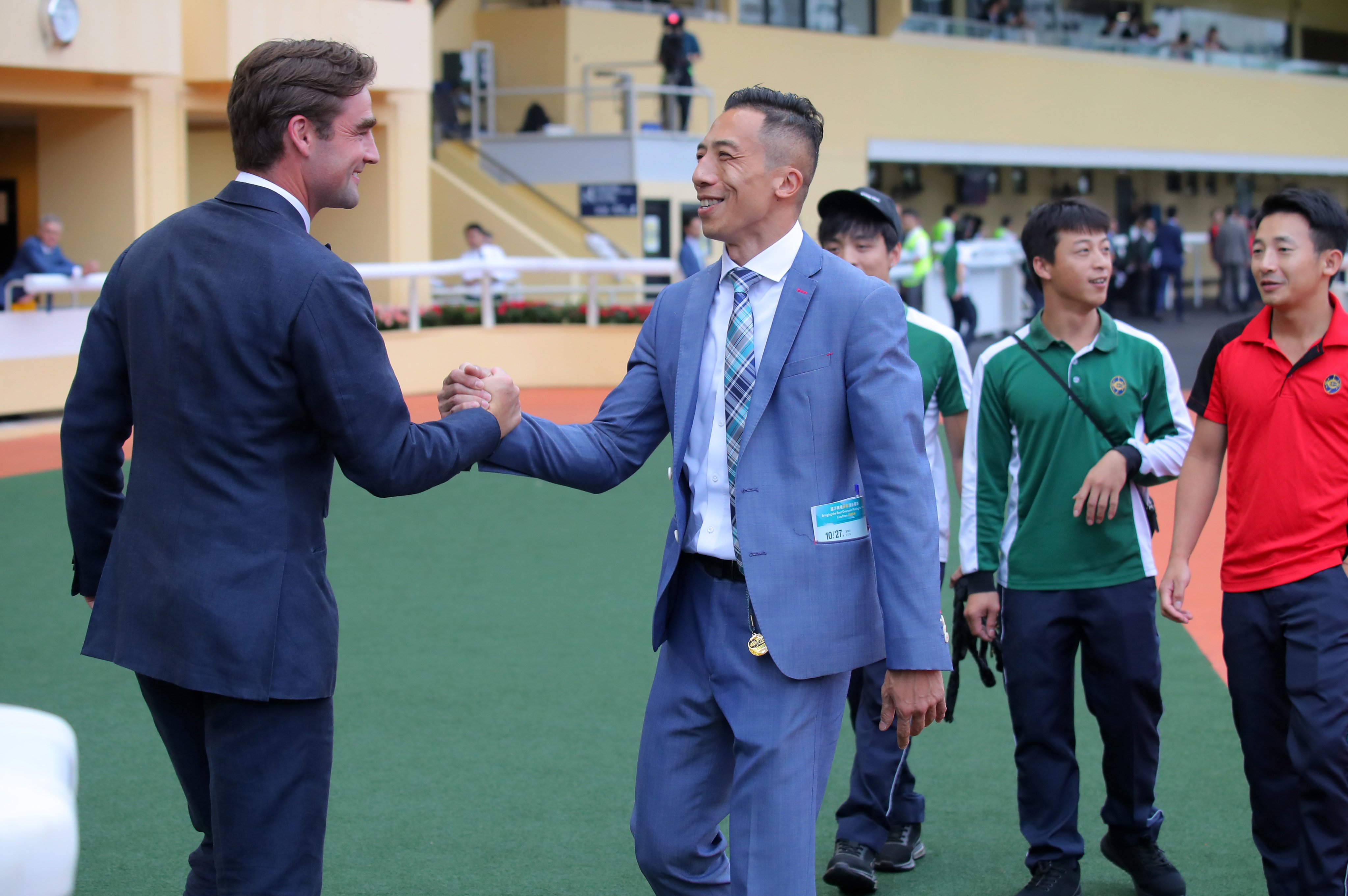 Trainer David Eustace (left) celebrates his maiden Hong Kong double with assistant Cash Lee. Photos: Kenneth Chan