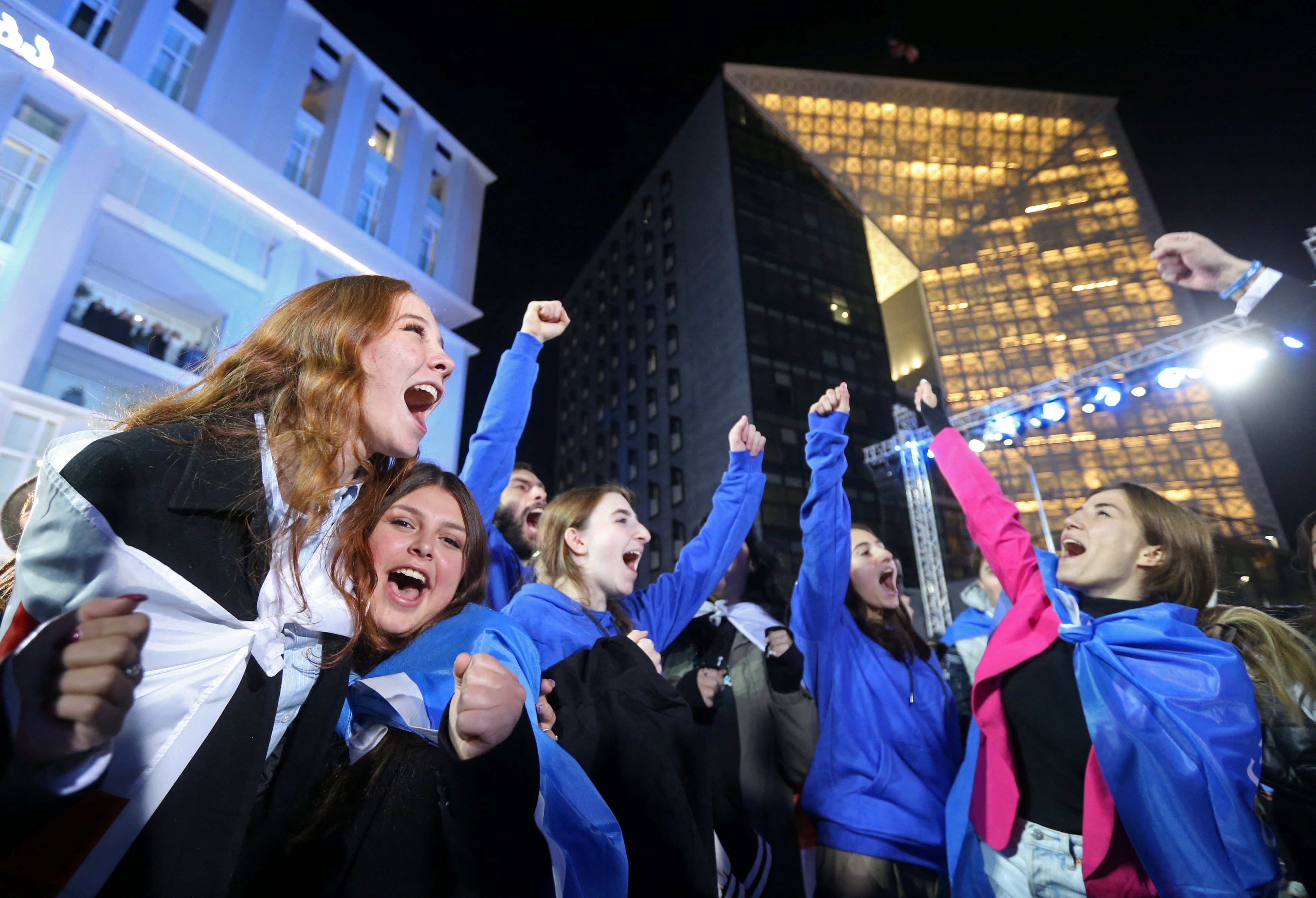 Georgian Dream supporters celebrate at the party’s headquarters after the announcement of exit poll results in Tbilisi on Saturday. Photo: Reuters