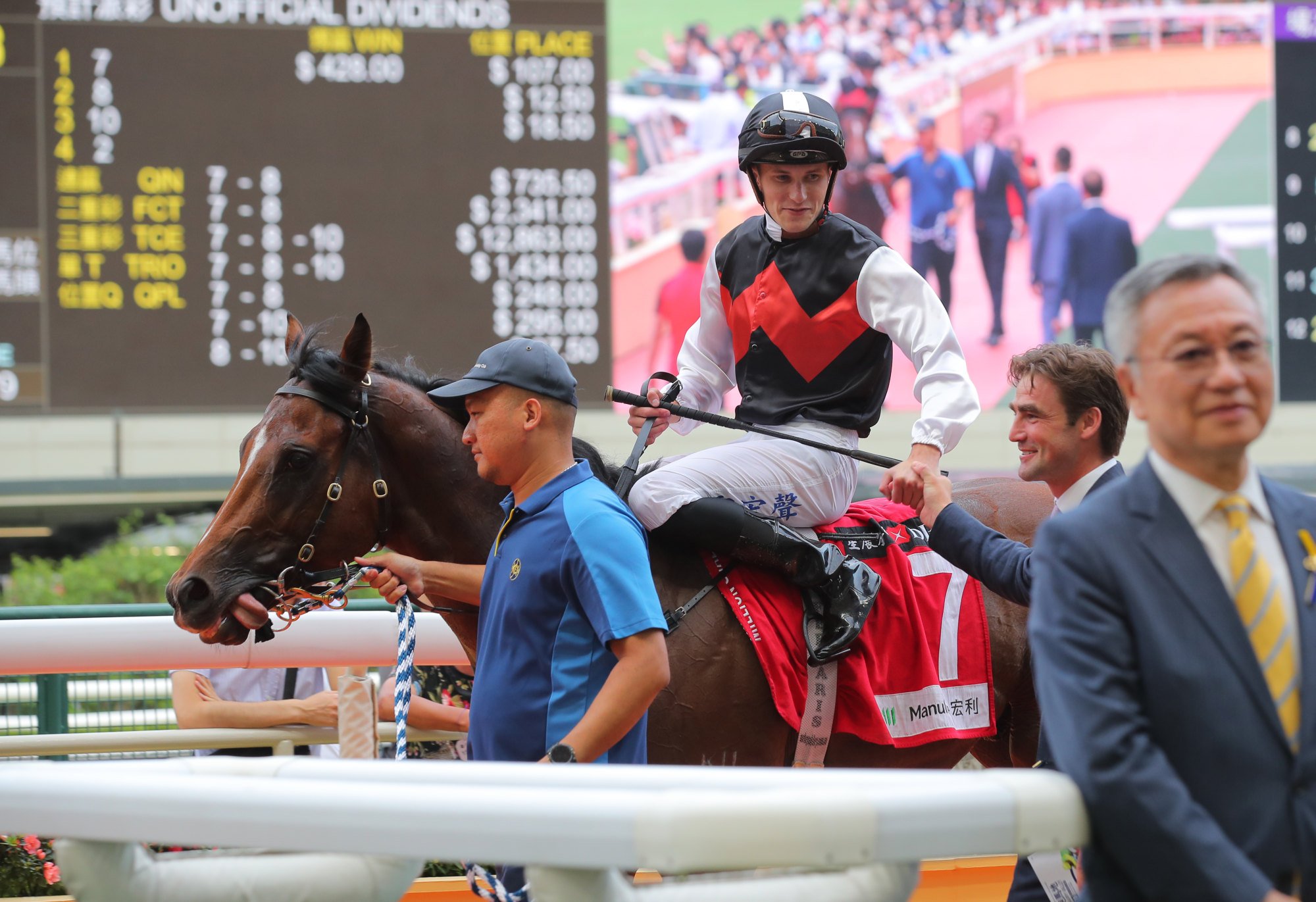 Jockey Luke Ferraris and trainer David Eustace celebrate Young Emperor’s victory.