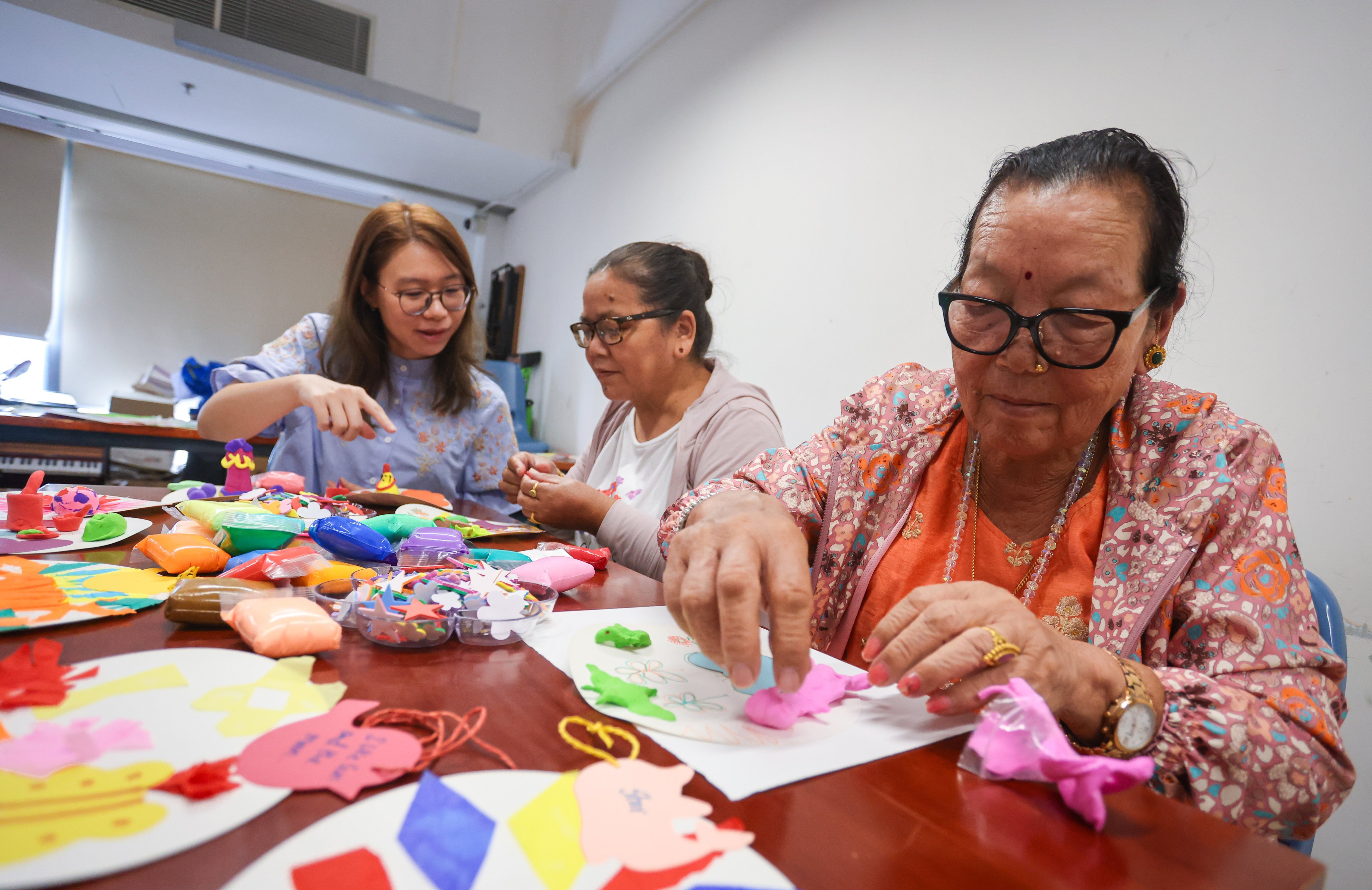 (From left) Janet Li with Bhanu Gurung and Ash Maya Limbu. Photo: Jonathan Wong