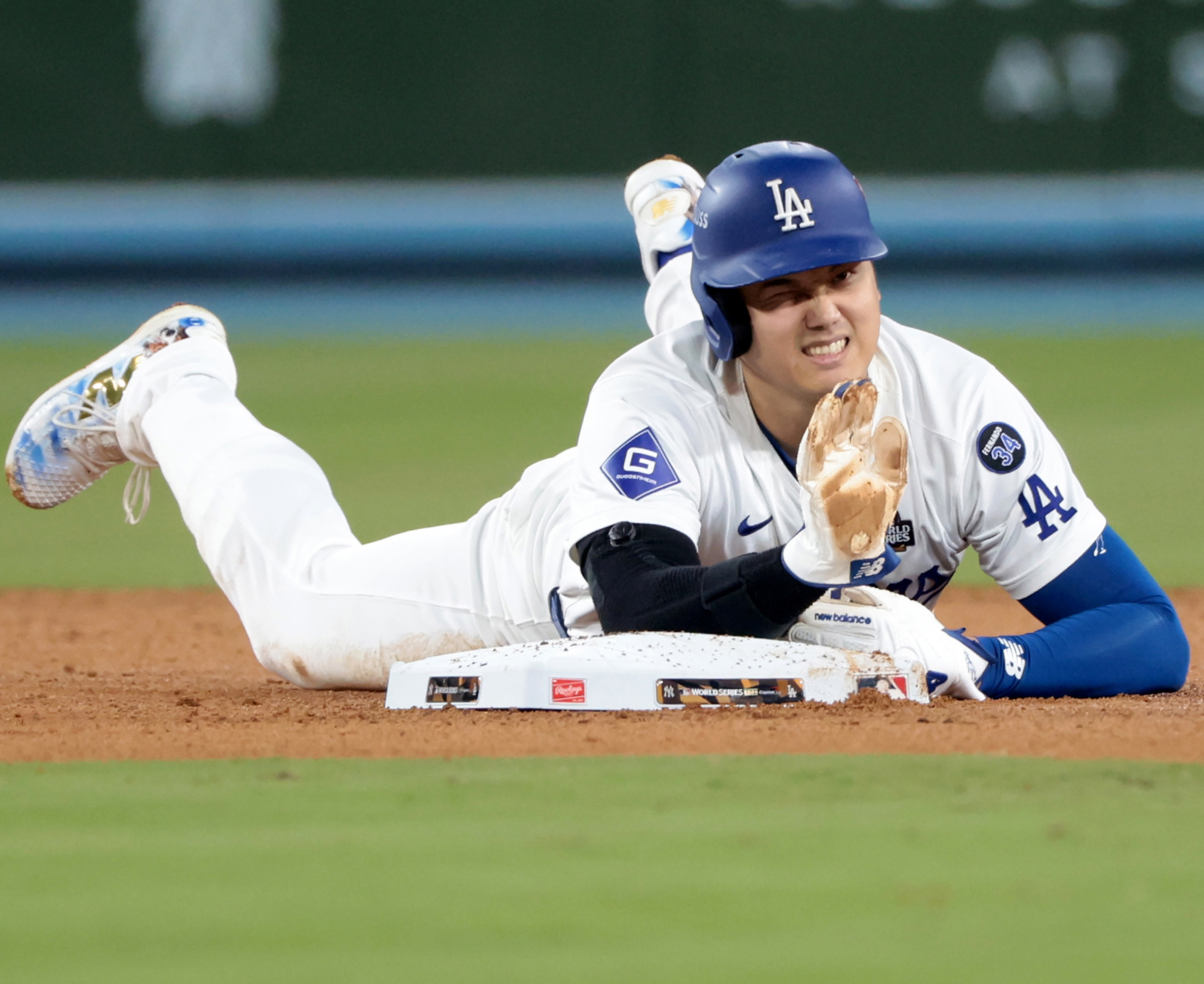 The Los Angeles Dodgers’ Shohei Ohtani partially dislocated his left should in an attempt to steal second in Game 2. Photo: AP