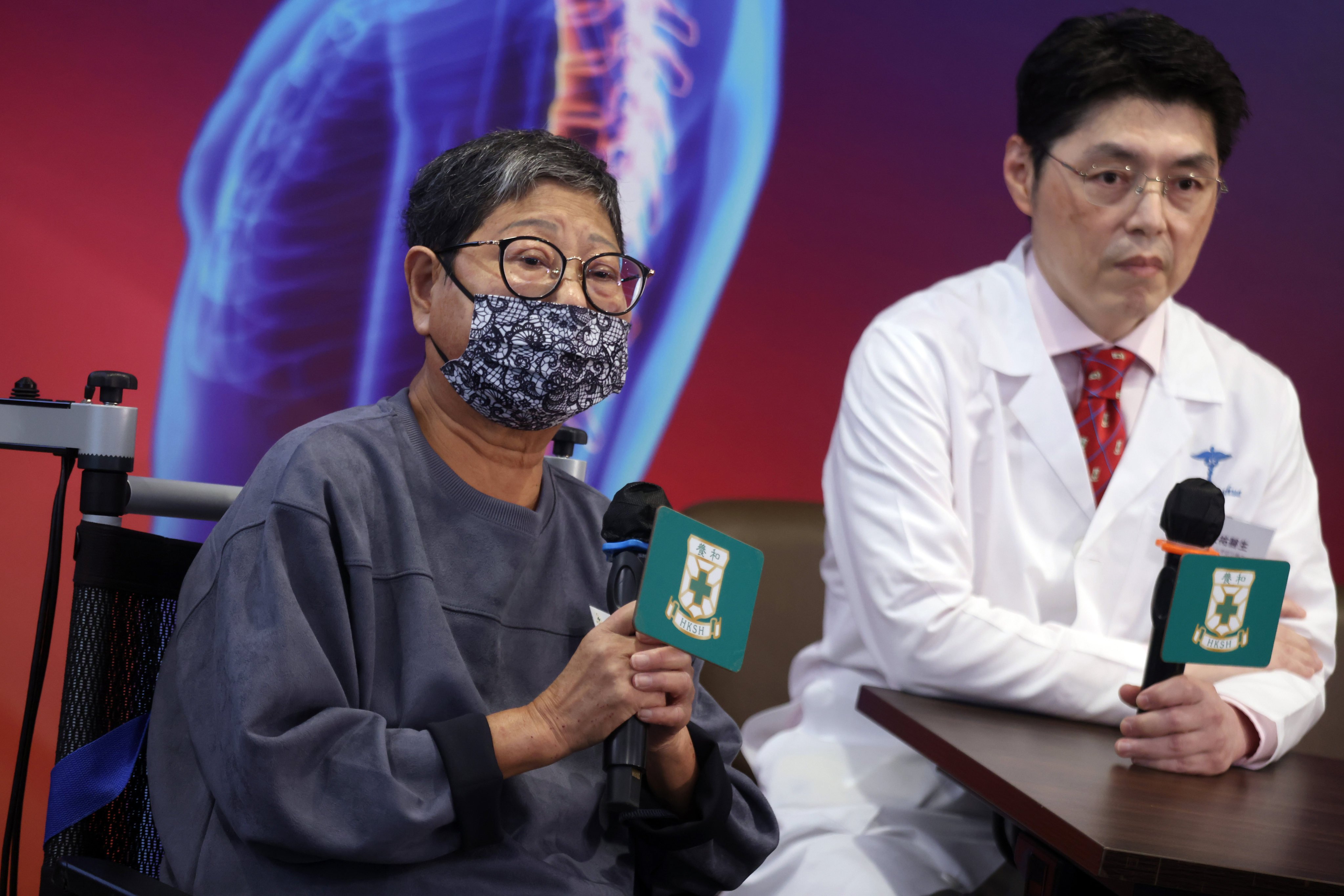 Patient Monita Yuen (left), 68, at a press conference held by Hong Kong Sanitorium and Hospital to announce the results of its survey of 800 residents’ spinal health. Photo: Jonathan Wong