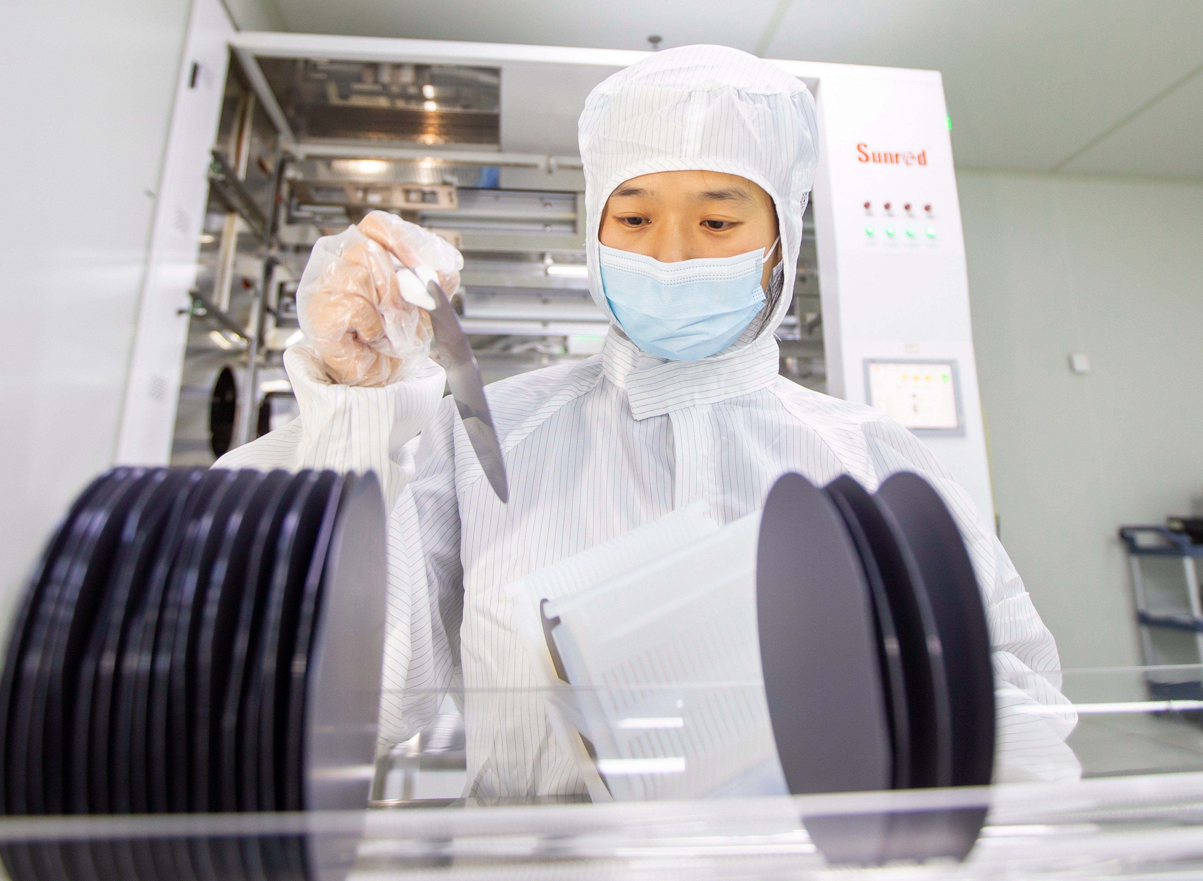 An employee produces semiconductor chips at a microelectronics enterprise in Hai’an, Jiangsu province. Photo: VCG via Getty Images