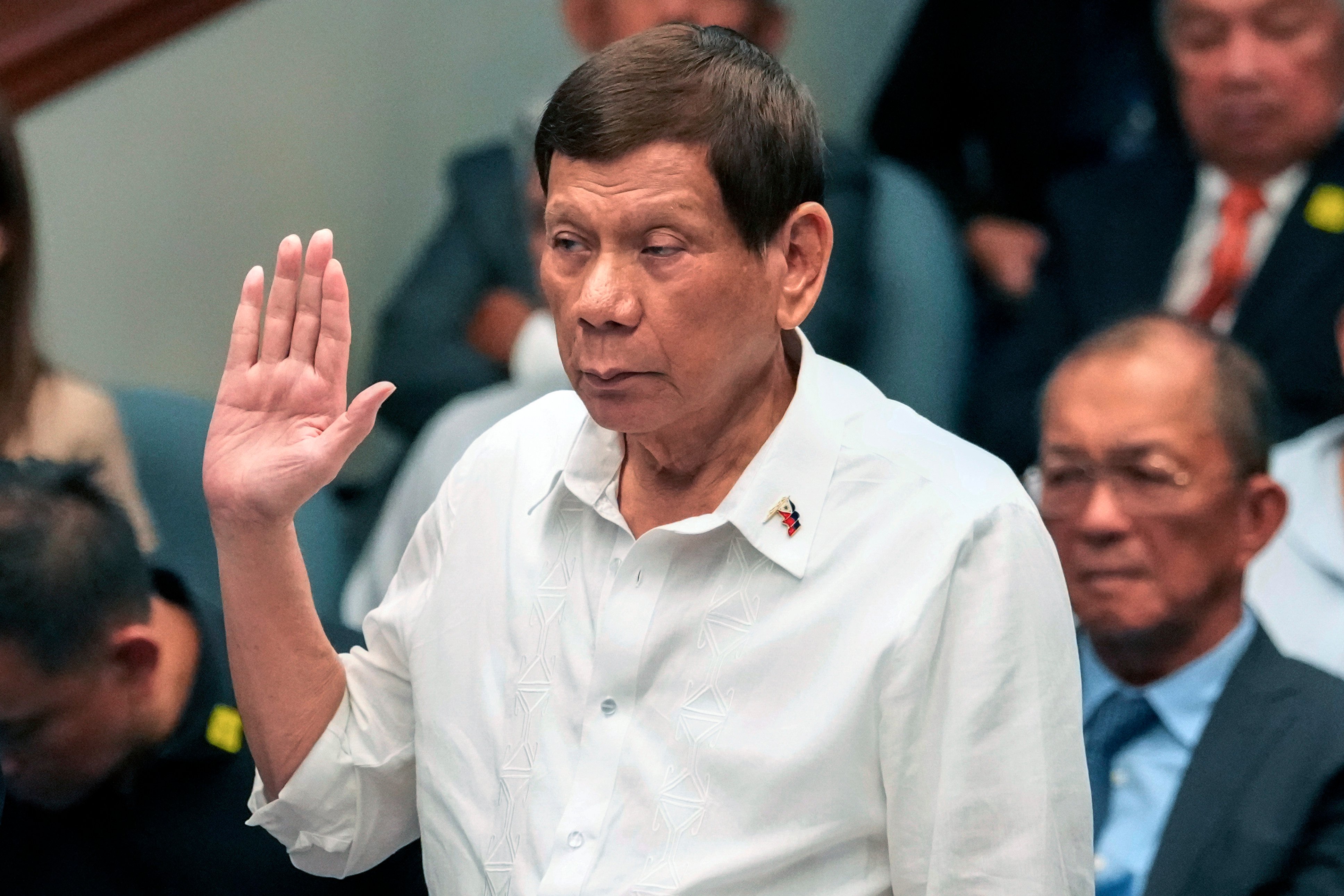 Ex-Philippine president Rodrigo Duterte takes his oath on Monday during a Senate inquiry on the so-called war on drugs during his administration. Photo: AP