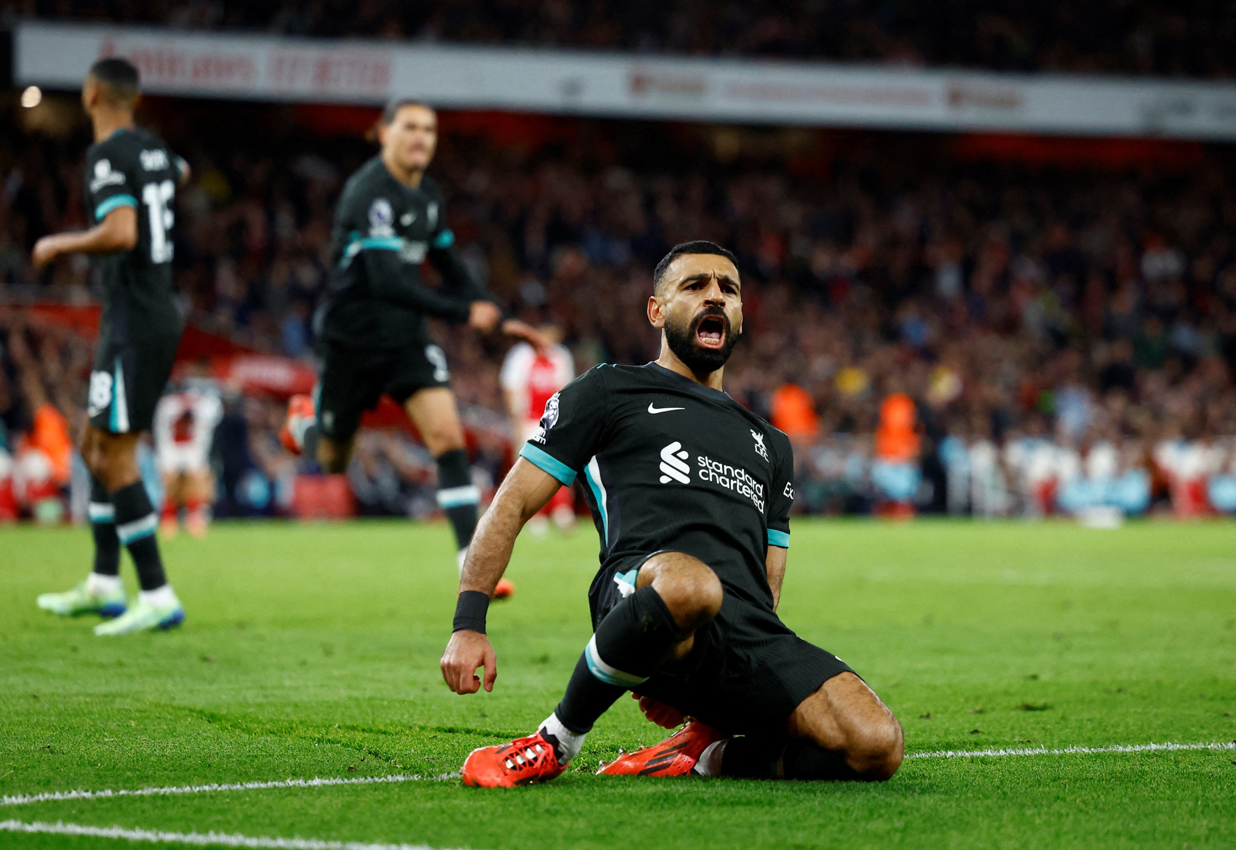 Liverpool’s Mohamed Salah celebrates scoring his side’s late equaliser against Arsenal. Photo: Reuters