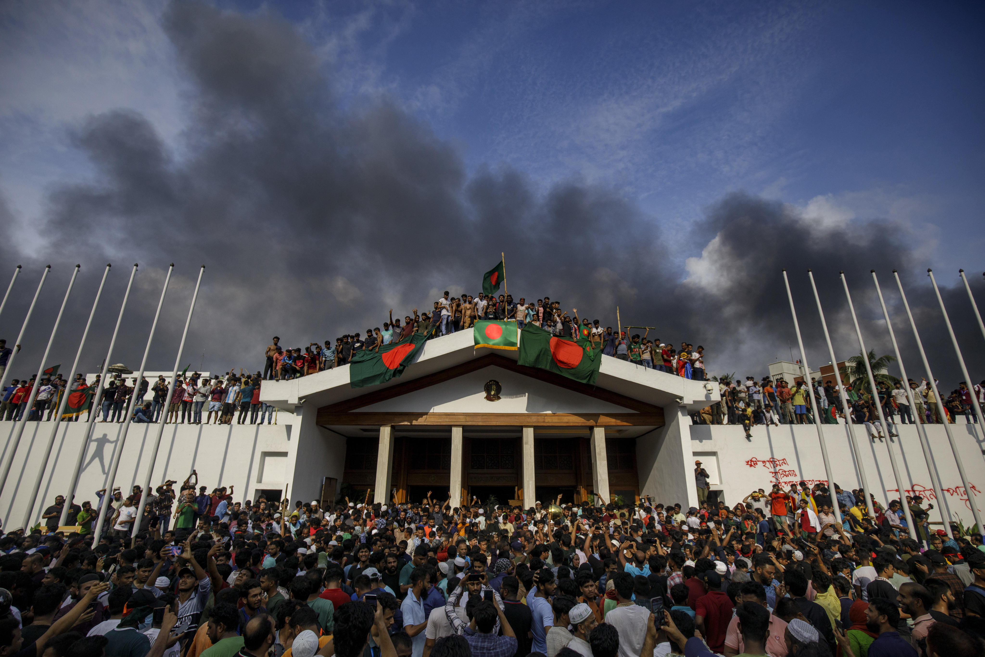 Anti-government protesters gather at Sheikh Hasina’s palace in Dhaka on August 5, the day Bangladesh’s former prime minister resigned and fled the country. Photo: Zuma Press Wire/dpa