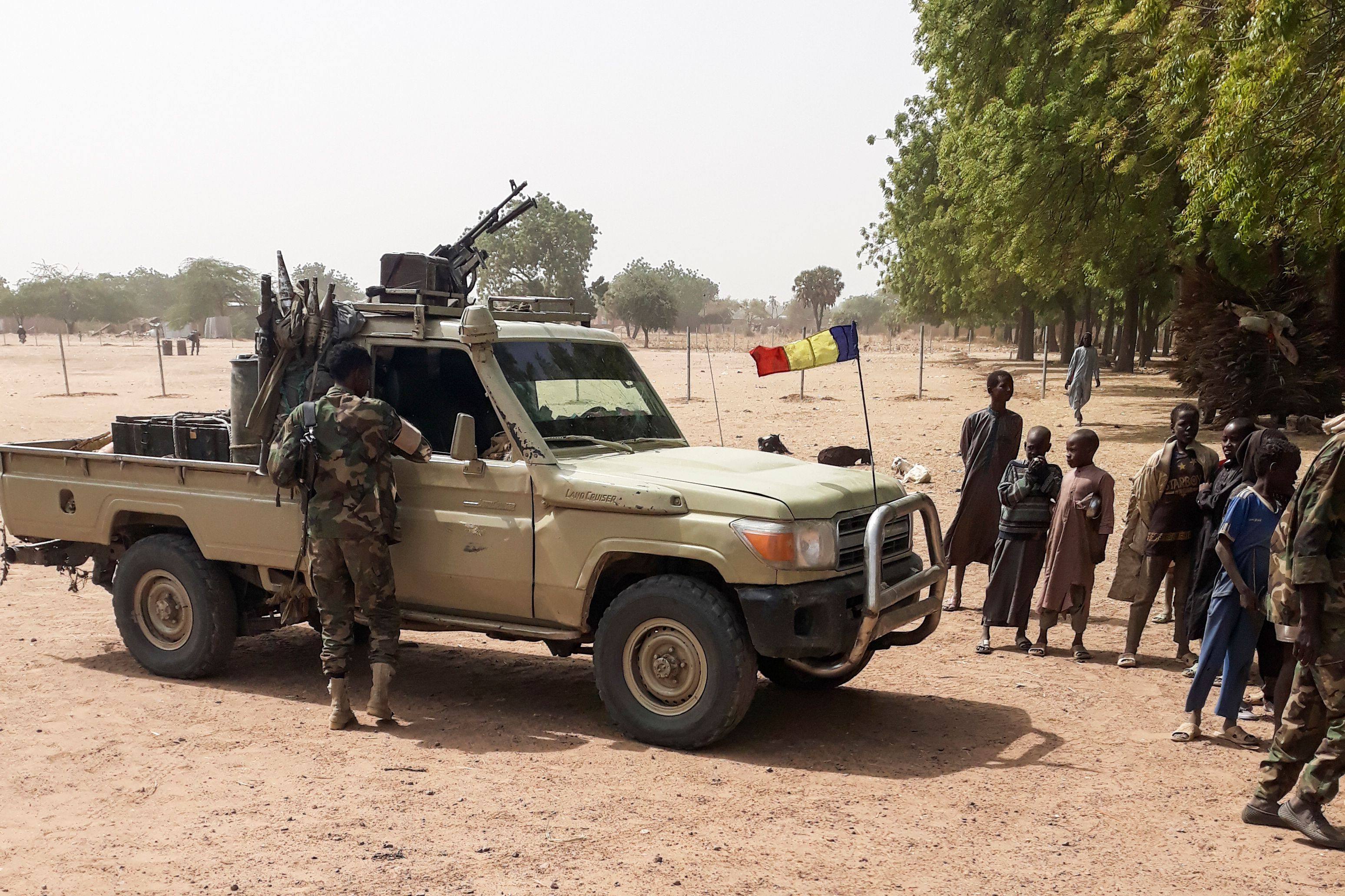 Soldiers of the Chad Army stand next to a Land Cruiser 25km (16 miles) from N’Djamena, on January 3, 2020. At least 40 Chadian troops were killed during an attack by Boko Haram. Photo: AFP