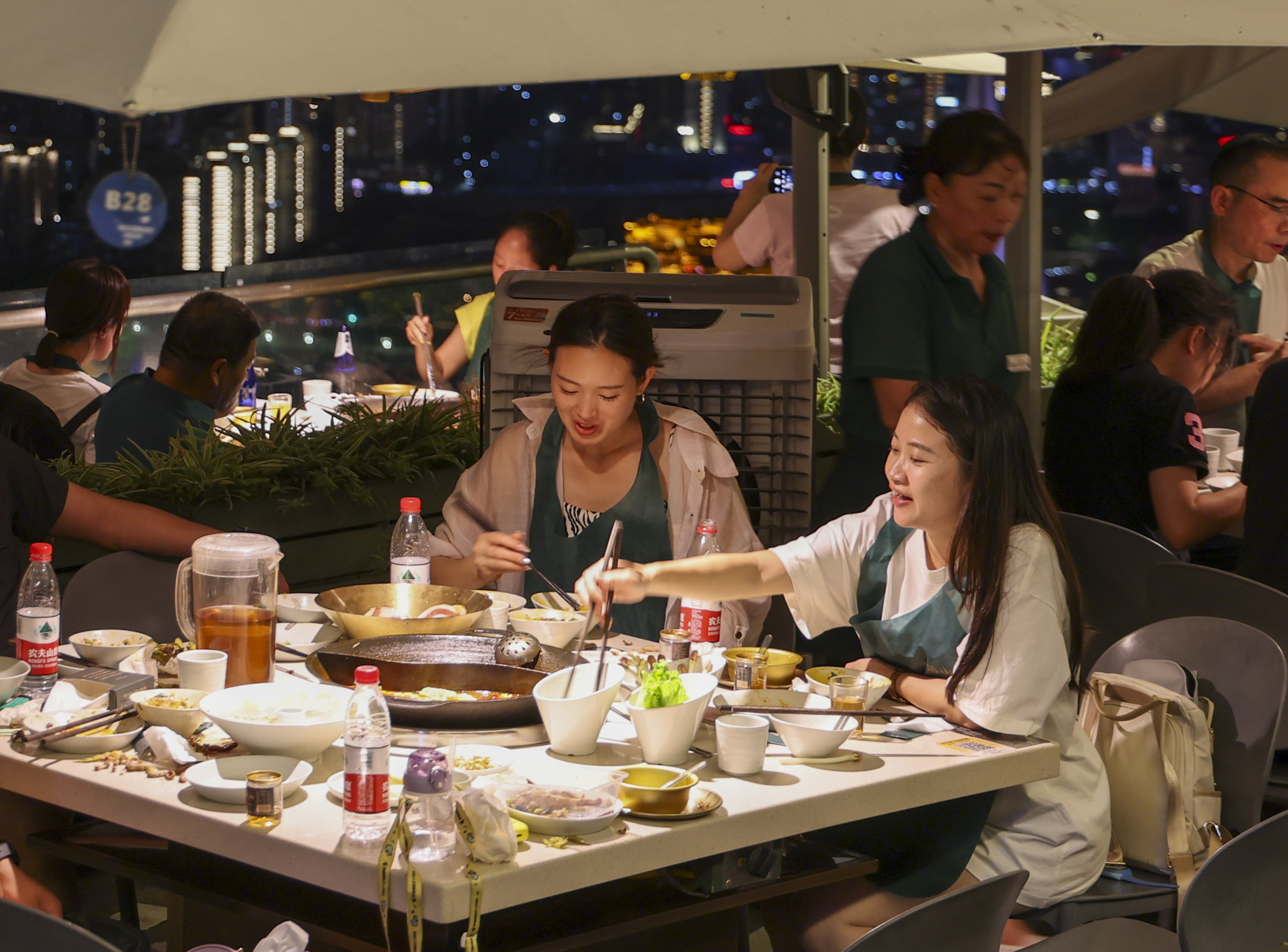 Tourists enjoy Chongqing hotpot in a restaurant at the Nanshan scenic spot in Chongqing, southwest China. Photo: Xinhua