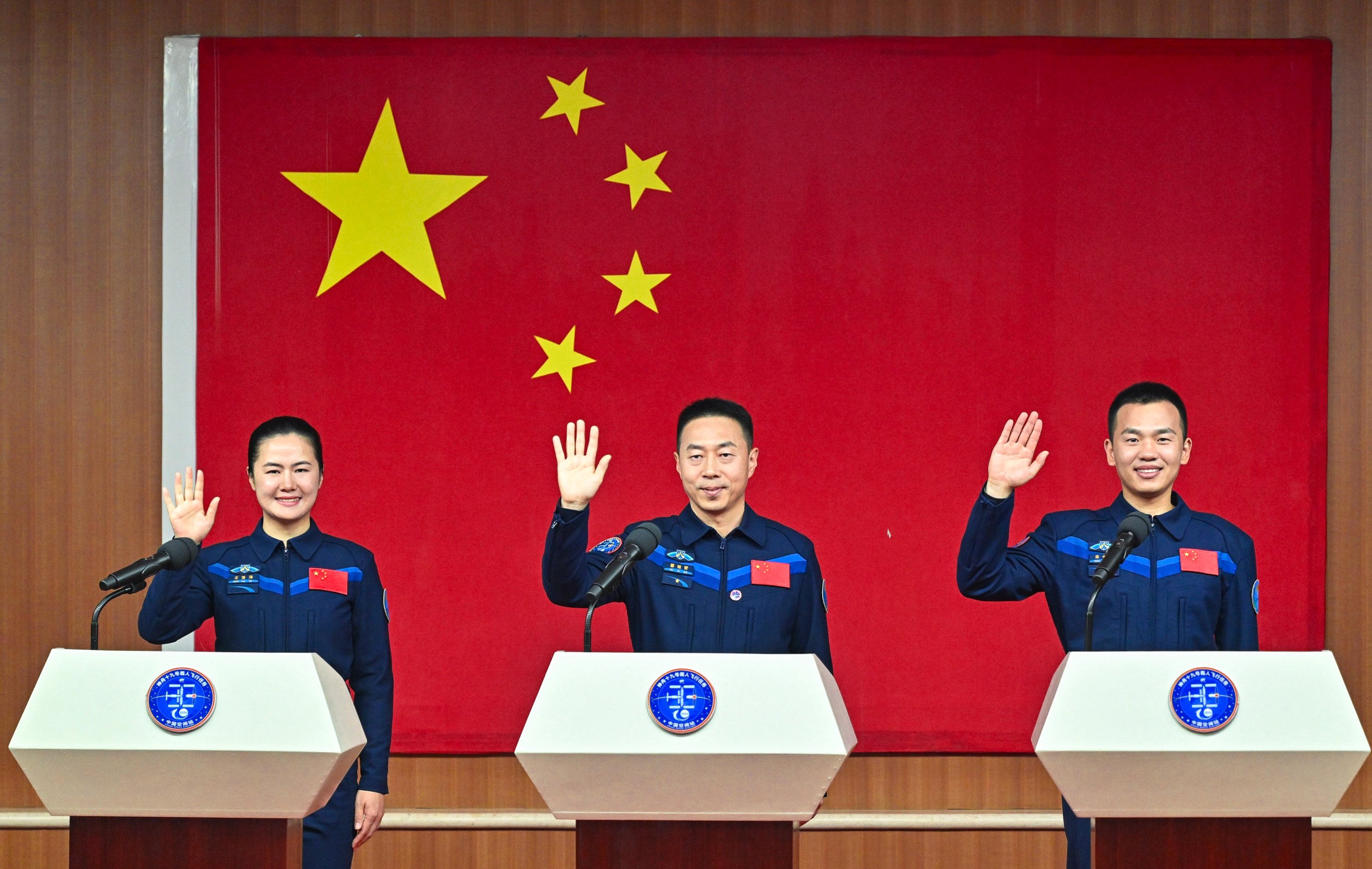 Chinese astronauts Cai Xuzhe (centre), Wang Haoze, left, and Song Lingdong will carry out the Shenzhou-19 spaceflight mission that launches from the Jiuquan Satellite Launch Centre. Photo: Xinhua