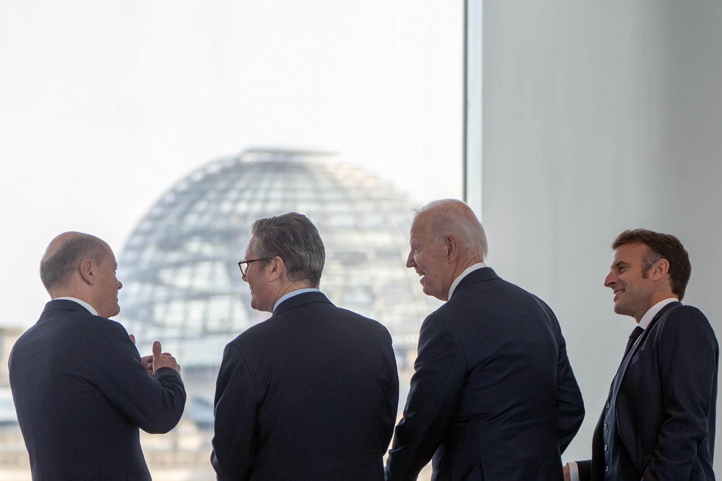 From the left, German Chancellor Olaf Scholz, British Prime Minister Keir Starmer, US President Joe Biden and French President Emmanuel Macron gather in front of the Reichstag building in Berlin on October 18. Photo: EPA-EFE