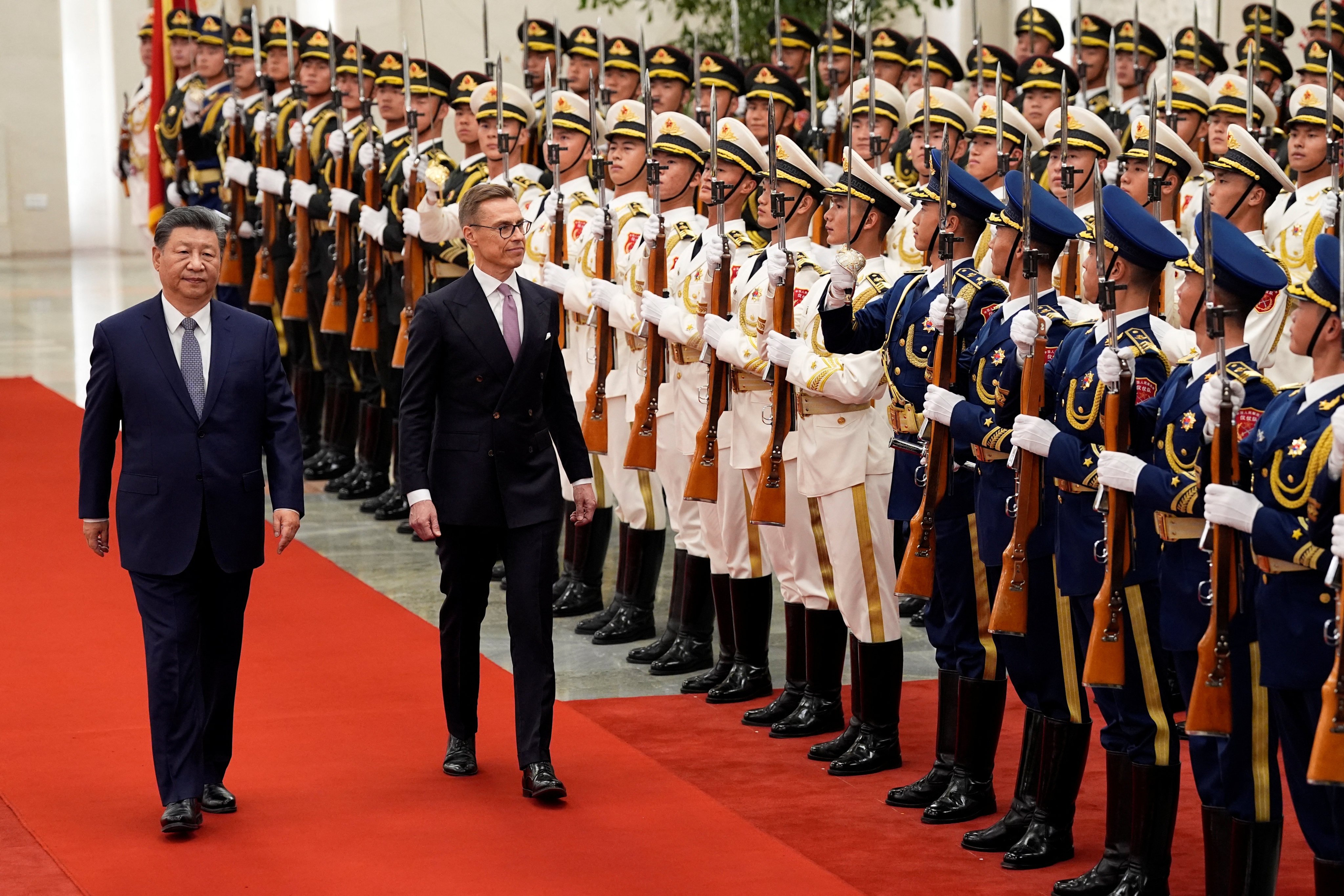 Chinese President Xi Jinping and Finland’s Alexander Stubb inspect a guard of honour at Beijing’s Great Hall of the People on Tuesday. Photo: Pool via Reuters