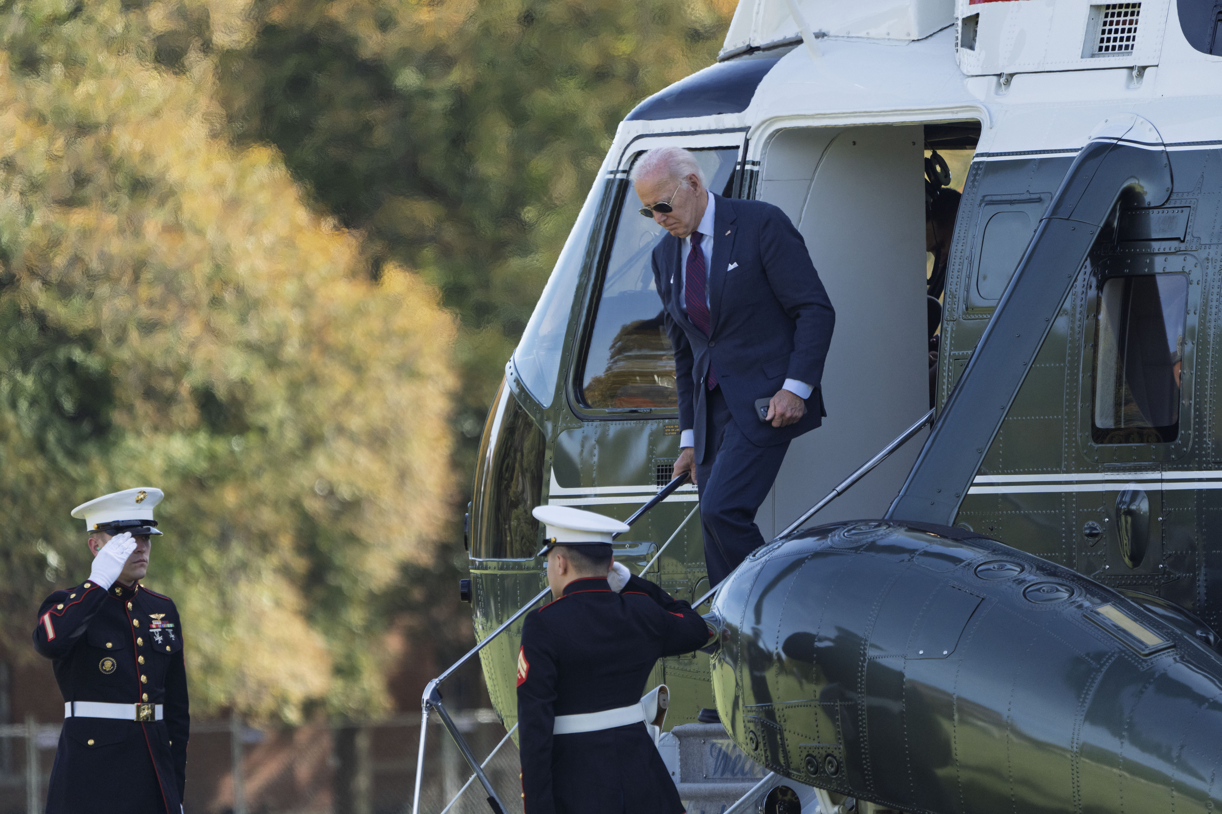 US President Joe Biden exits Marine One as he arrives in Washington on Monday. The American leader’s term in office ends in January. Photo: AP