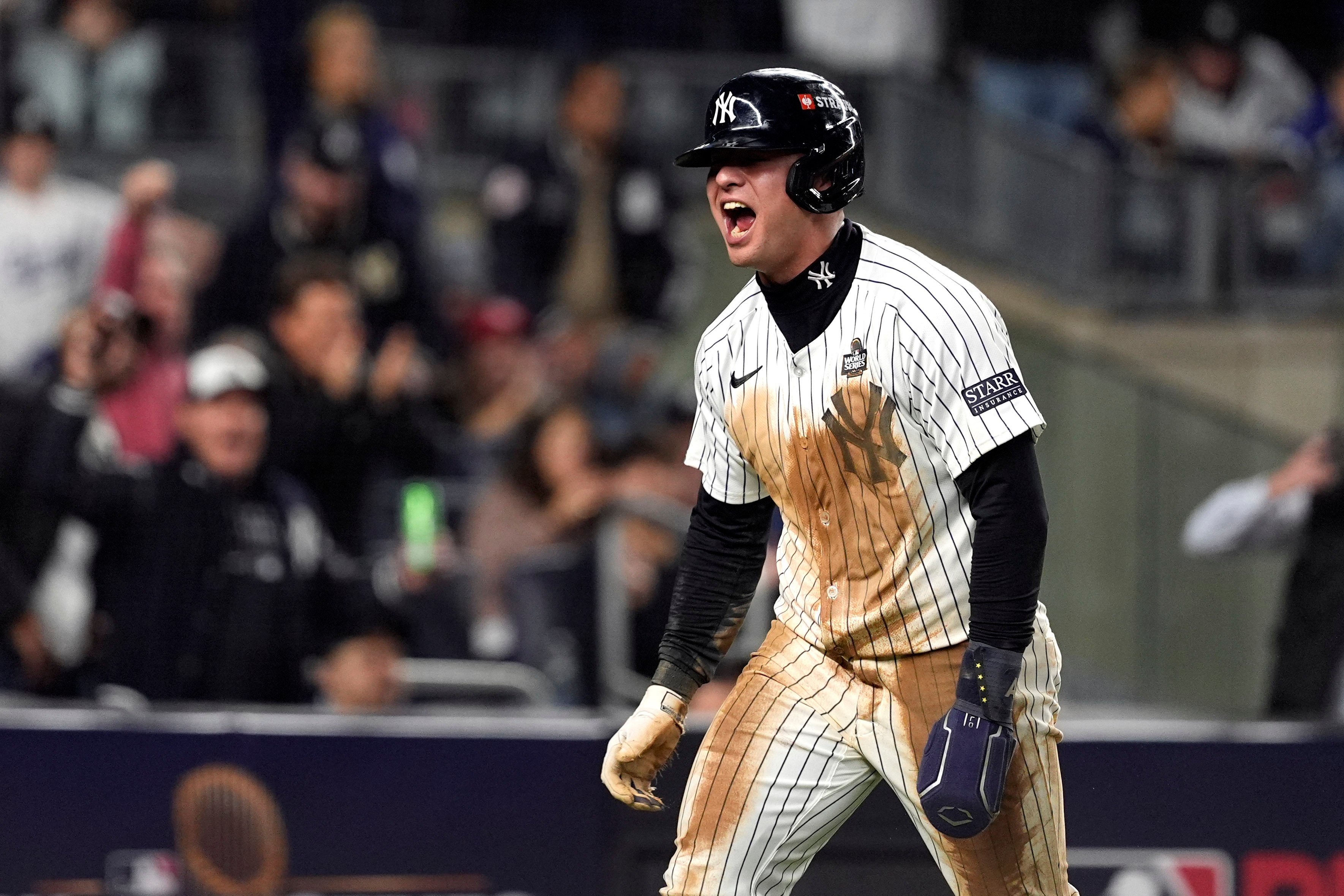 The Yankees’ Anthony Volpe reacts after scoring against the Los Angeles Dodgers during the eighth inning in Game 4 of the World Series in New York on Tuesday. Photo: AP