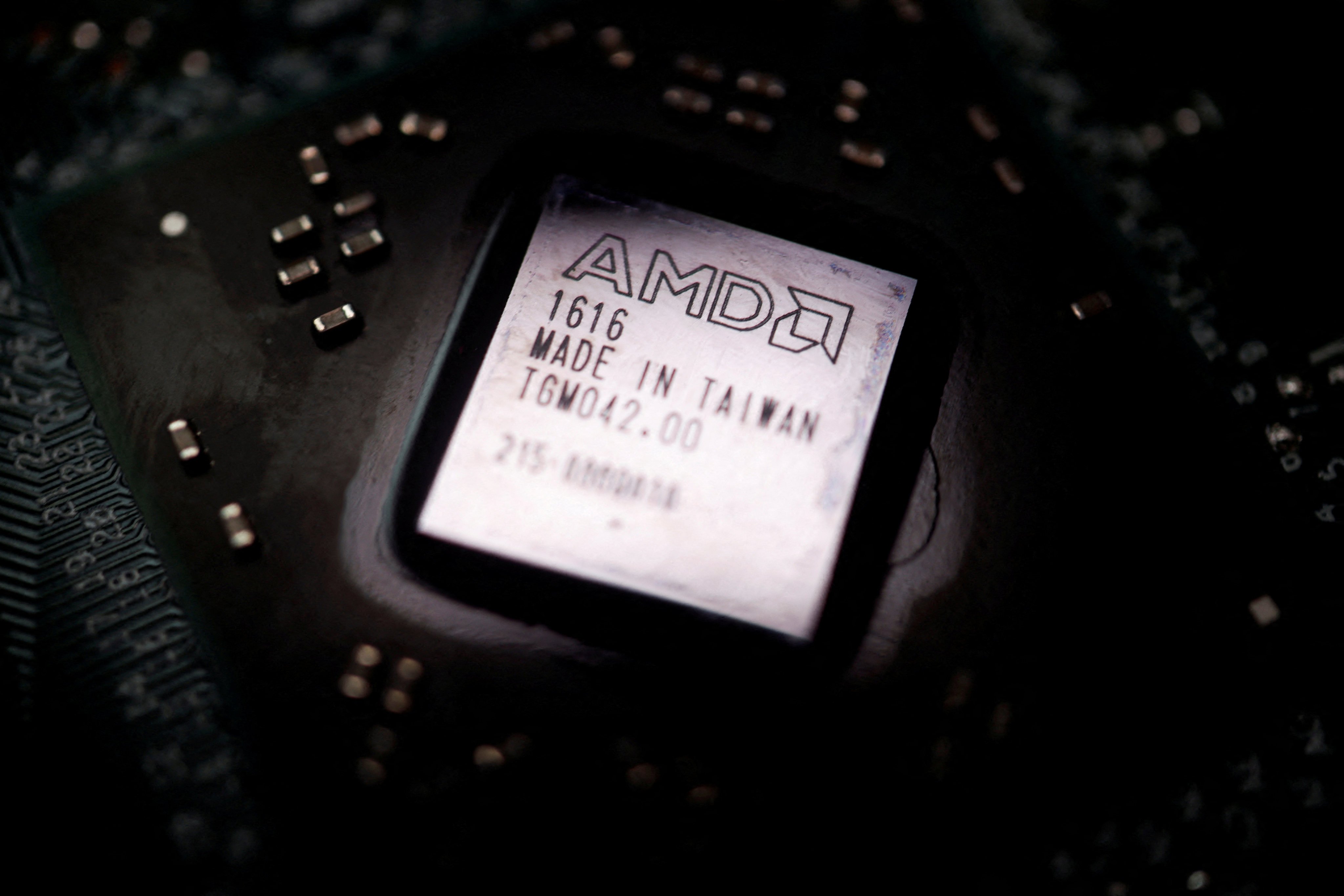 The AMD logo is seen on a GPU chip in this illustration picture taken February 17, 2023. Photo: Reuters