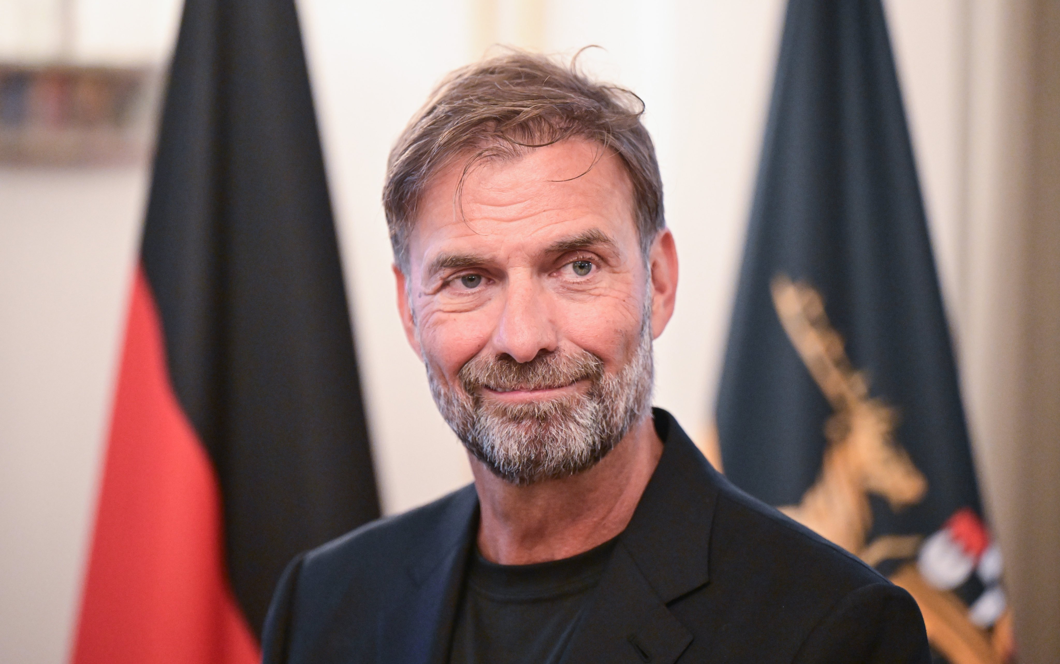 German coach Jurgen Klopp, seen here receiving the Order of Merit of the State of Baden-Wuerttemberg, has defended his decision to take the job as head of global football at drink giants Red Bull. Photo: dpa