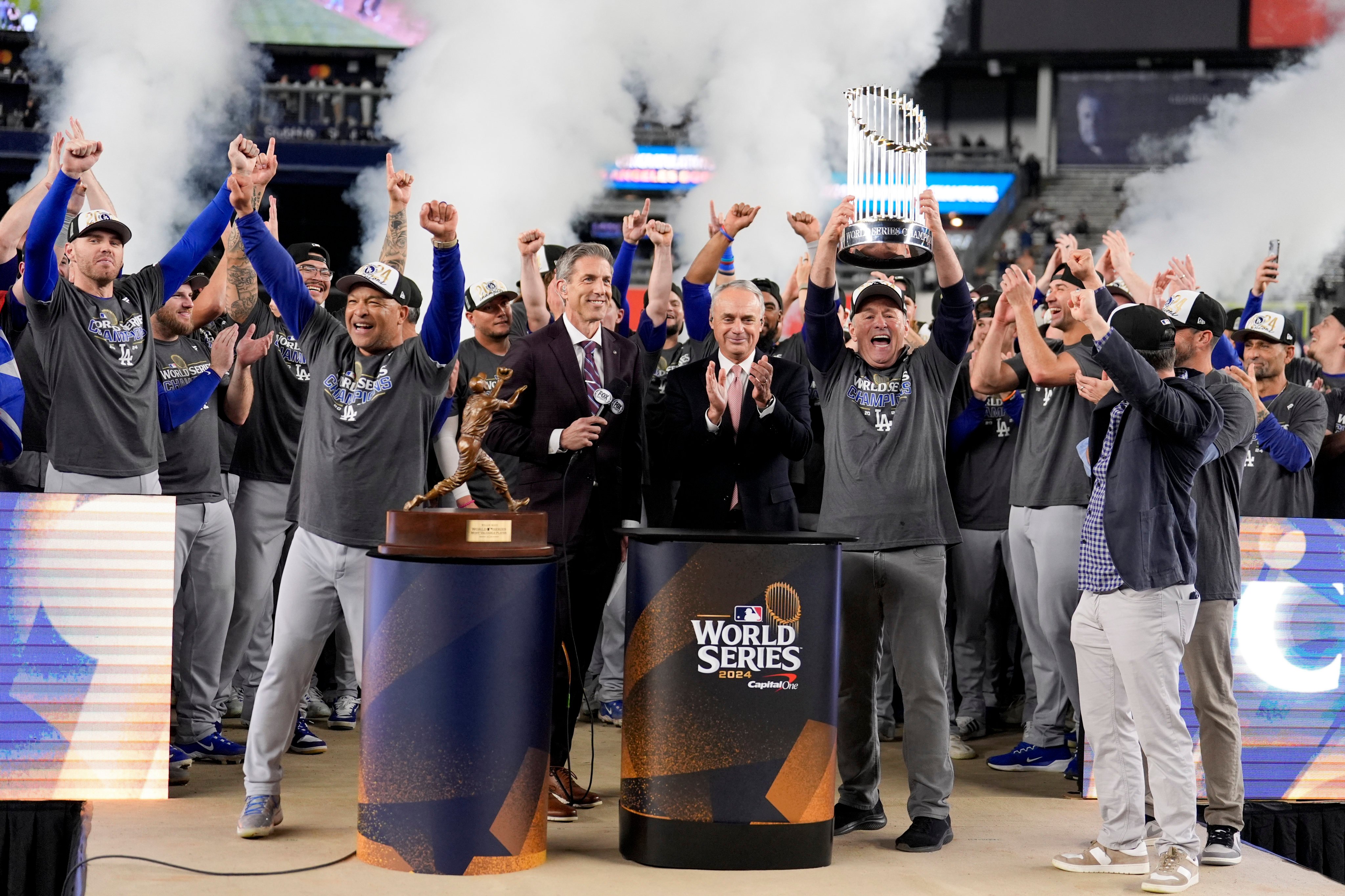 Los Angeles Dodgers’ Freddie Freeman celebrates with the trophy after their win against the New York Yankees in Game 5 to win the World Series on Thursday. Photo: AP