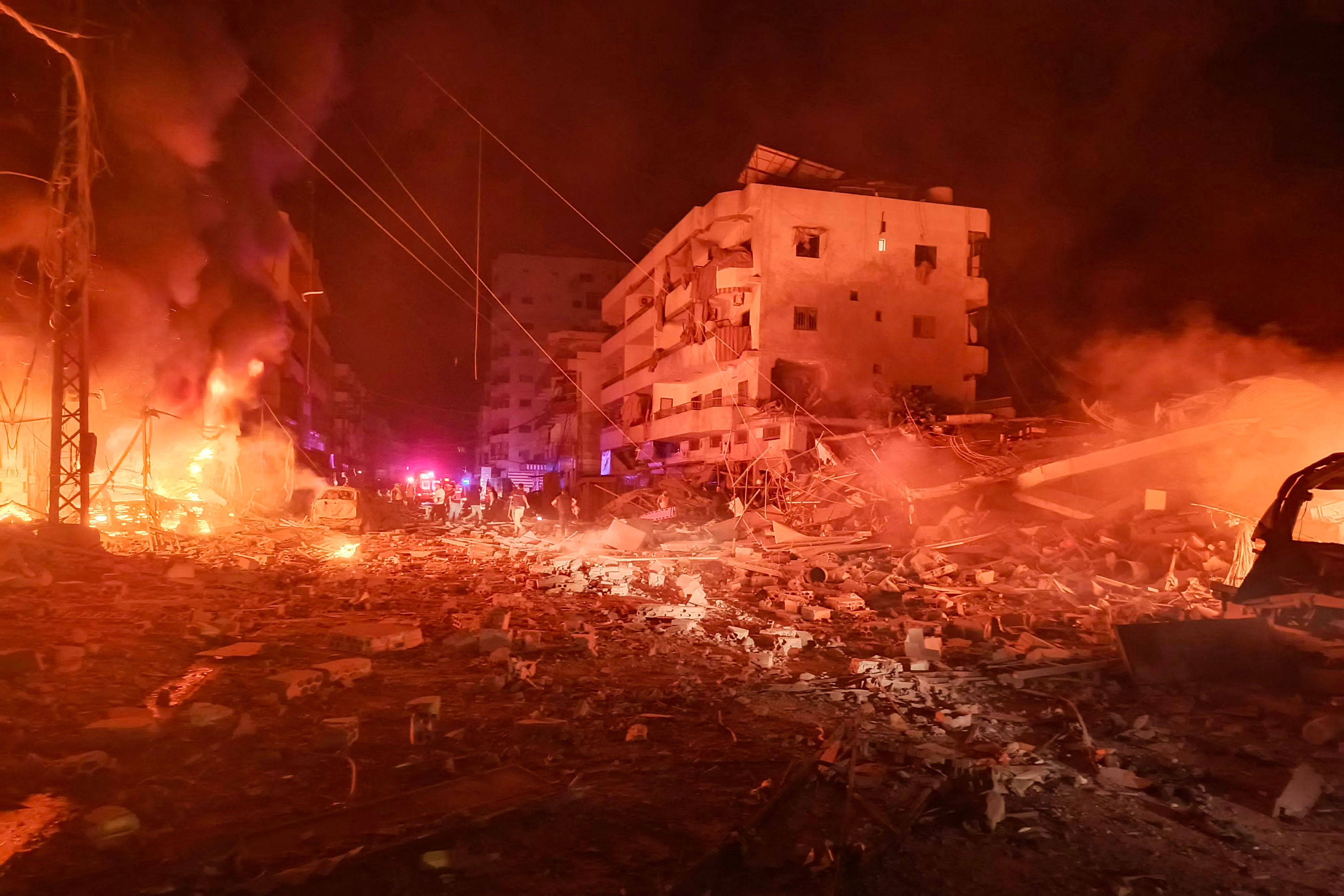 First responders work after an Israeli air strike that targeted the industrial zone in the southern Lebanese village of Abbasiyeh on Wednesday. Photo: AFP