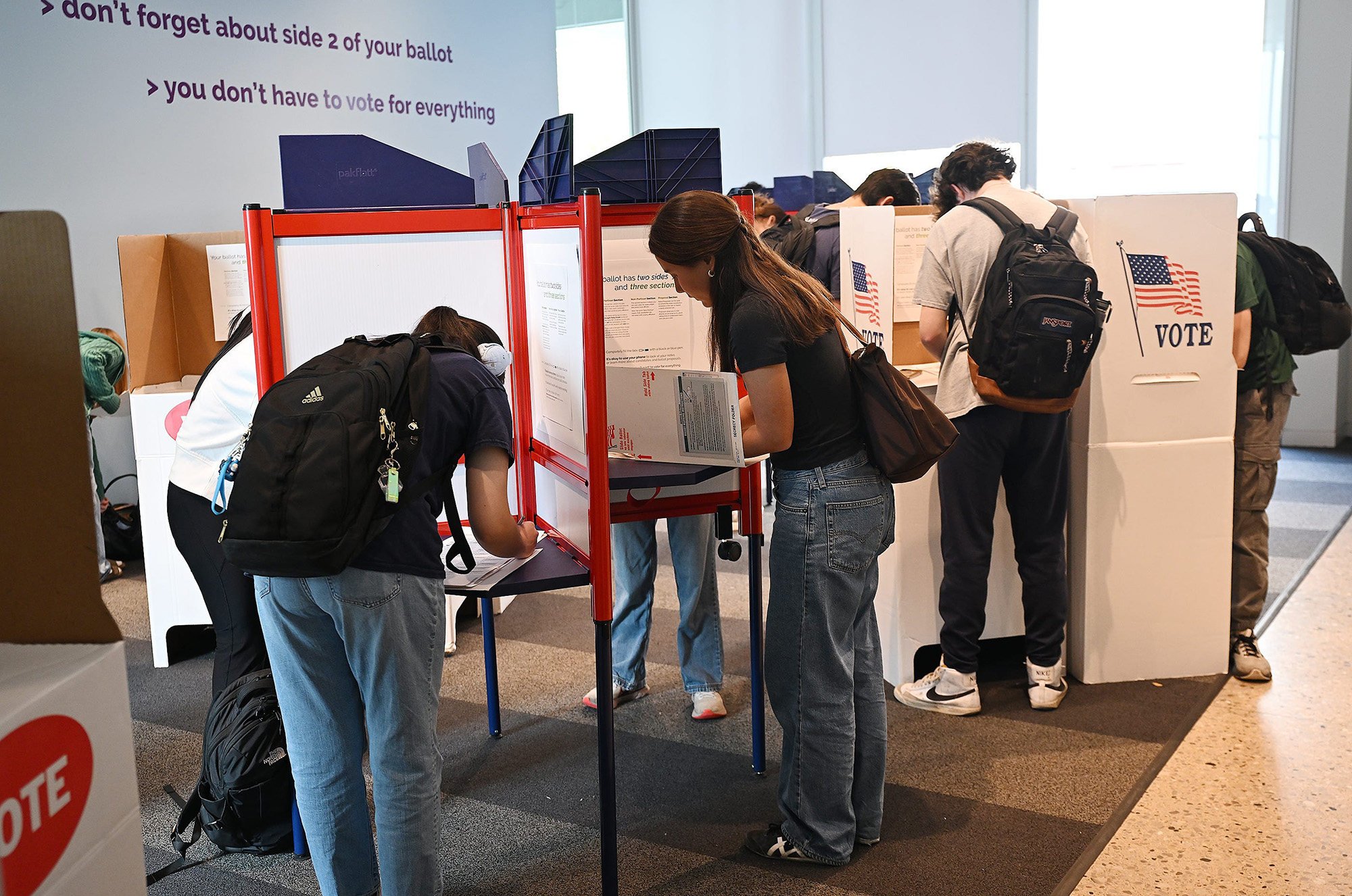 College students mark ballots on Wednesday at an early-voting site on the University of Michigan campus in Ann Arbor, Michigan. Photo: The Detroit News/TNS