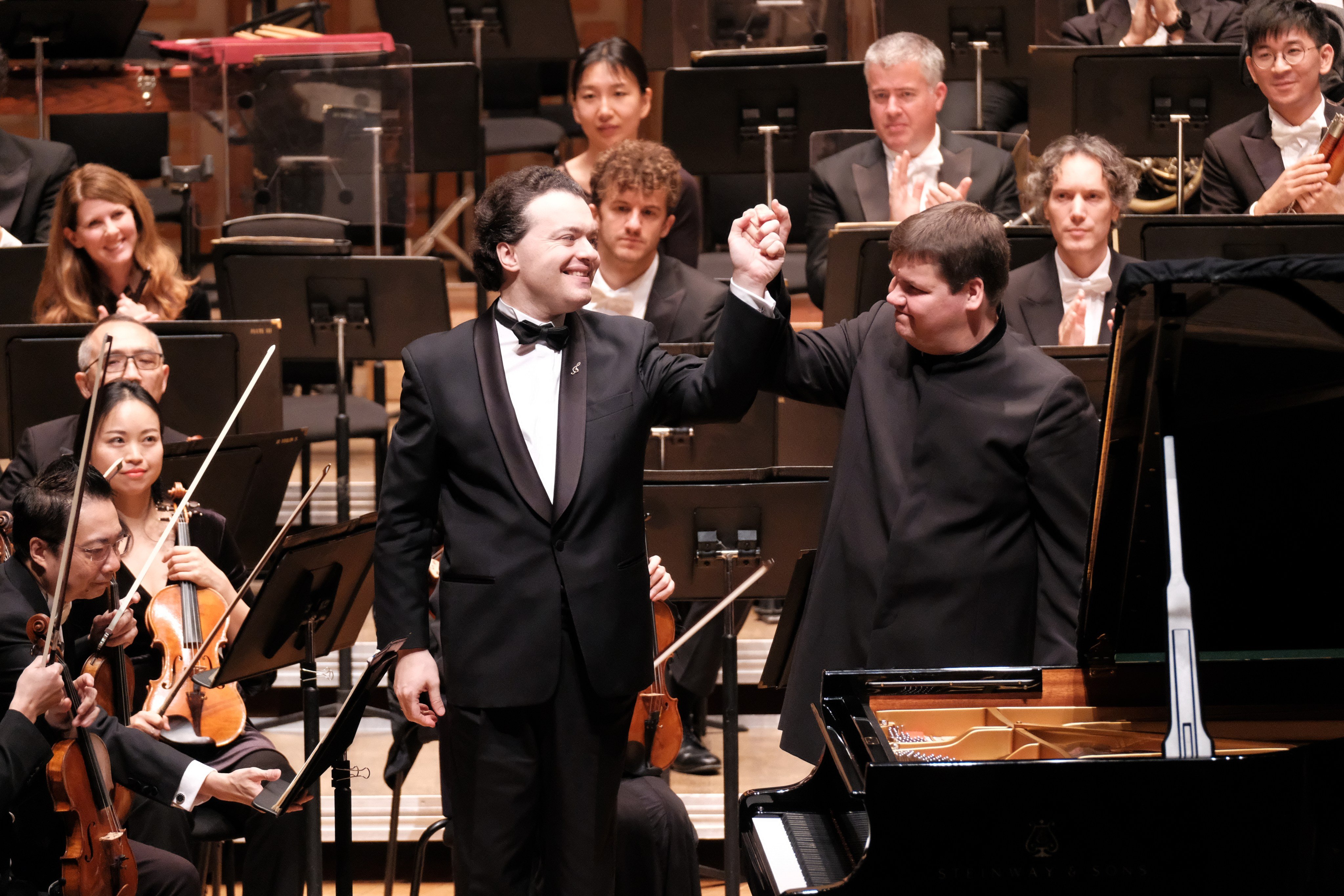 Evgeny Kissin and conductor Andris Poga receive the applause of the audience in 2018 after a performance by the Russian-born pianist with the Hong Kong Philharmonic. After being named a “foreign agent” by Moscow over his support for Ukraine, Kissin cancelled his November 2024 recital in Hong Kong. Photo: Ka Lam/HKPhil