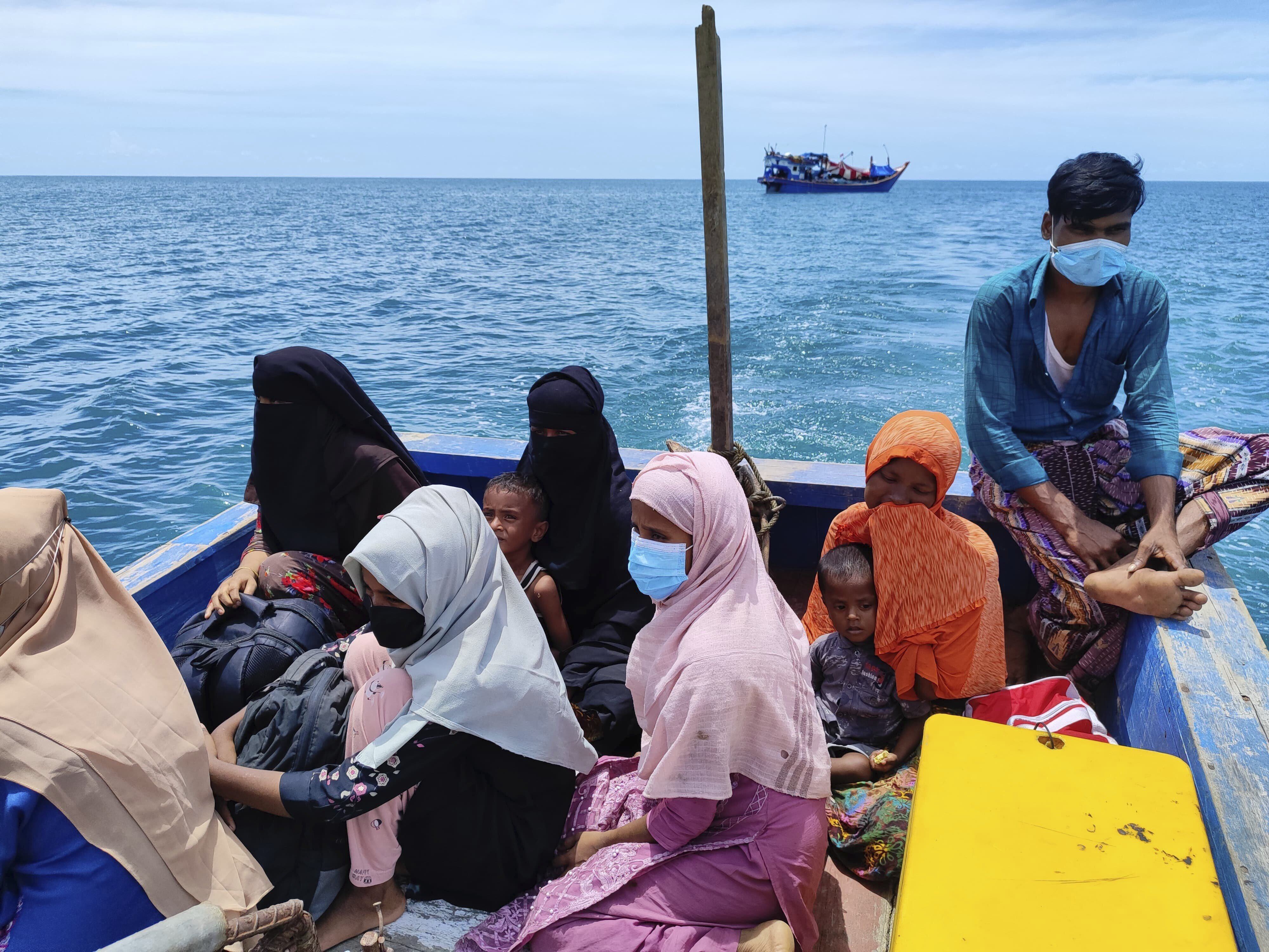 Rohingya Muslims sit in a rescue boat as they are transferred to land from their boat that has been anchored in the waters off Labuan Haji, Aceh province, Indonesia, on October 24. Photo: AP/File