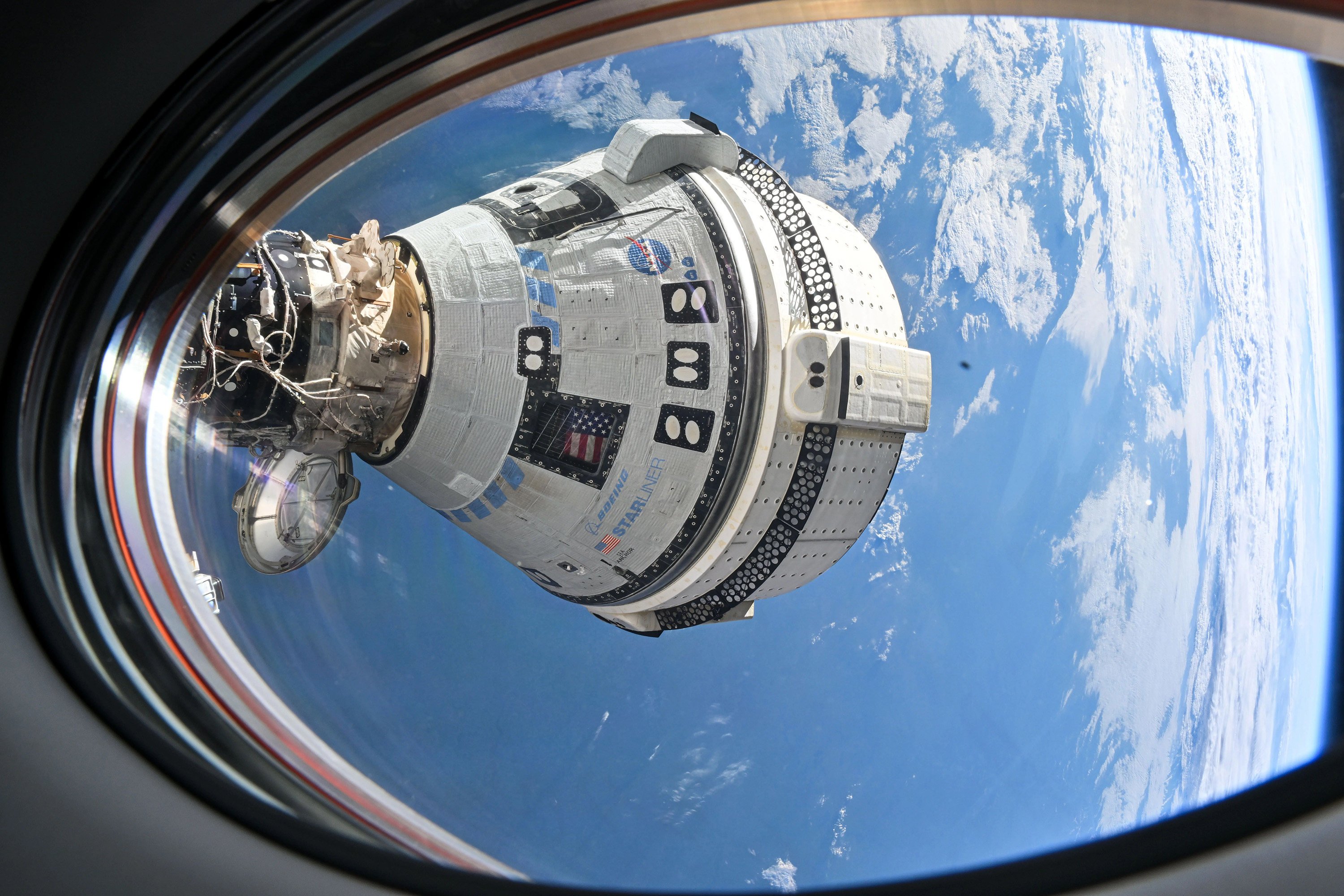 Boeing’s Starliner spacecraft, seen here docked at the International Space Station, was expected to bring US astronauts Butch Wilmore and Suni Williams home in June after an eight-day mission. Photo: TNS