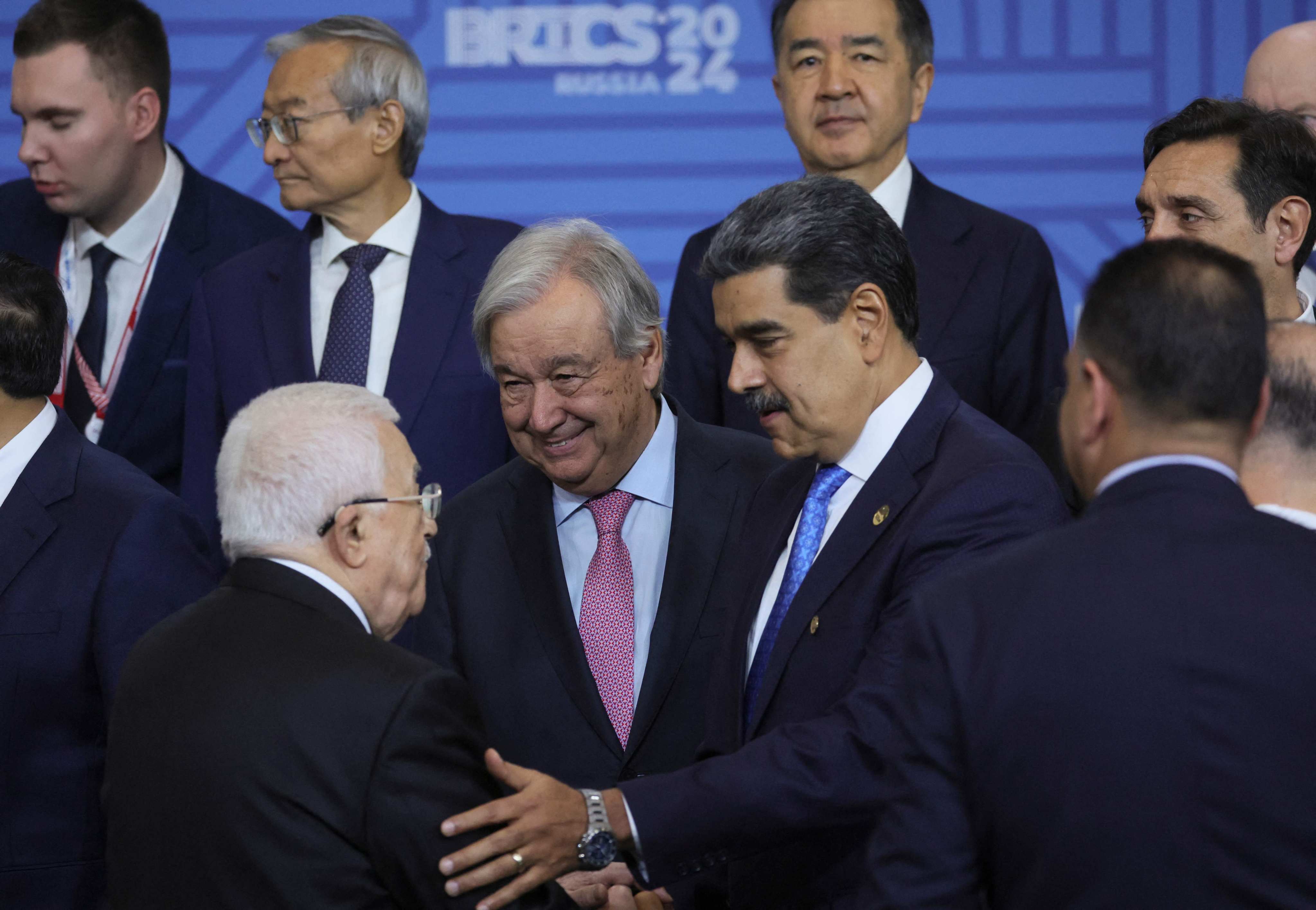 Palestinian Authority president Mahmoud Abbas (centre left) speaks with United Nations secretary general Antonio Guterres (centre) and Venezuelan President Nicolas Maduro (centre right) as participants in the Brics Plus meeting pose for a family photo during the Brics summit in Kazan on October 24. Photo: AFP 