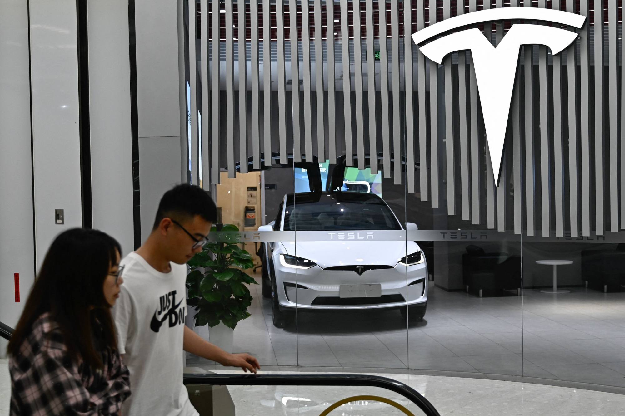 A Tesla showroom at a shopping centre in Beijing on July 9, 2024. Photo: AFP