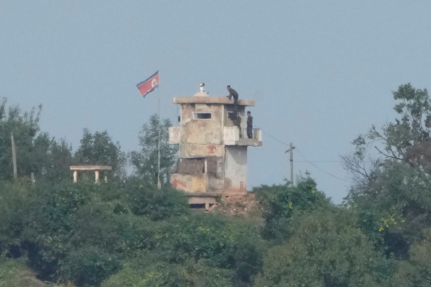 North Korean soldiers at a guard post, as seen from Paju, South Korea. Photo: AP