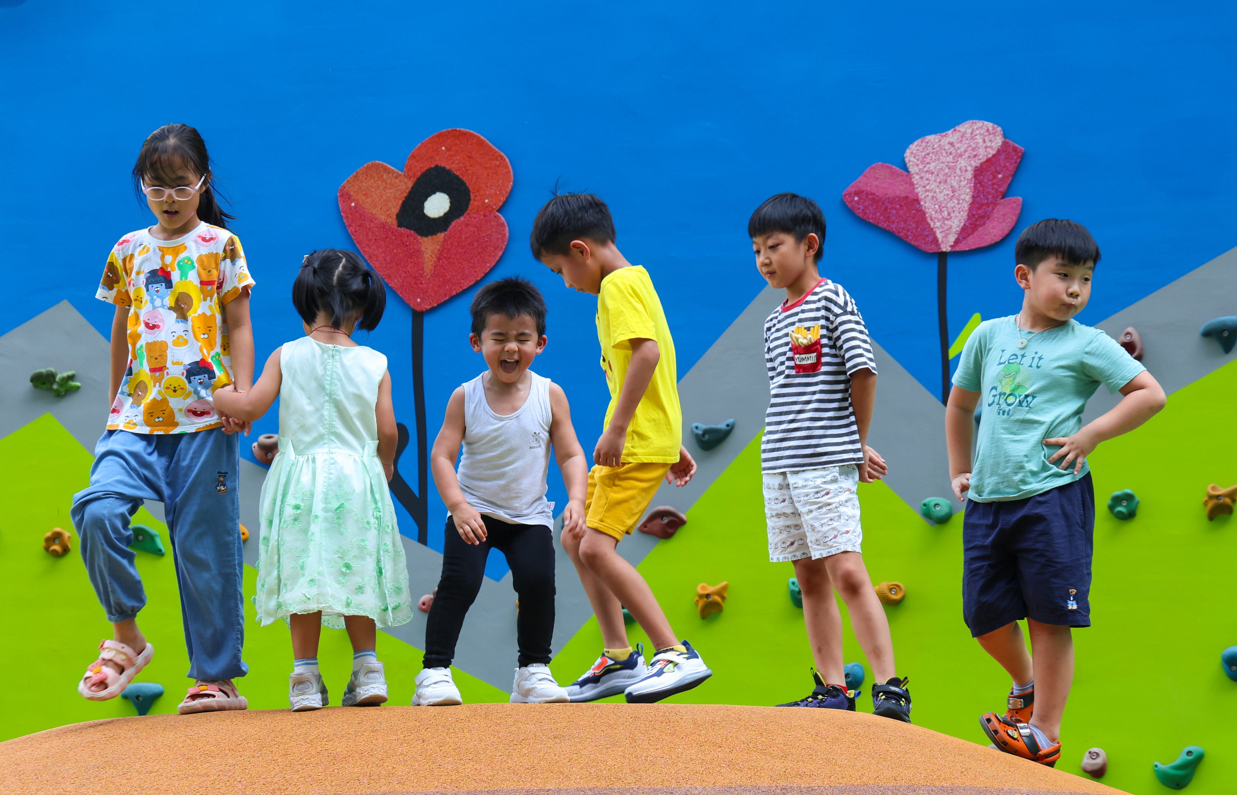 Children at a playground in Mong Kok. Lawmakers passed a bill in July requiring workers in 25 professions to report suspected child abuse to authorities. Photo: Jelly Tse