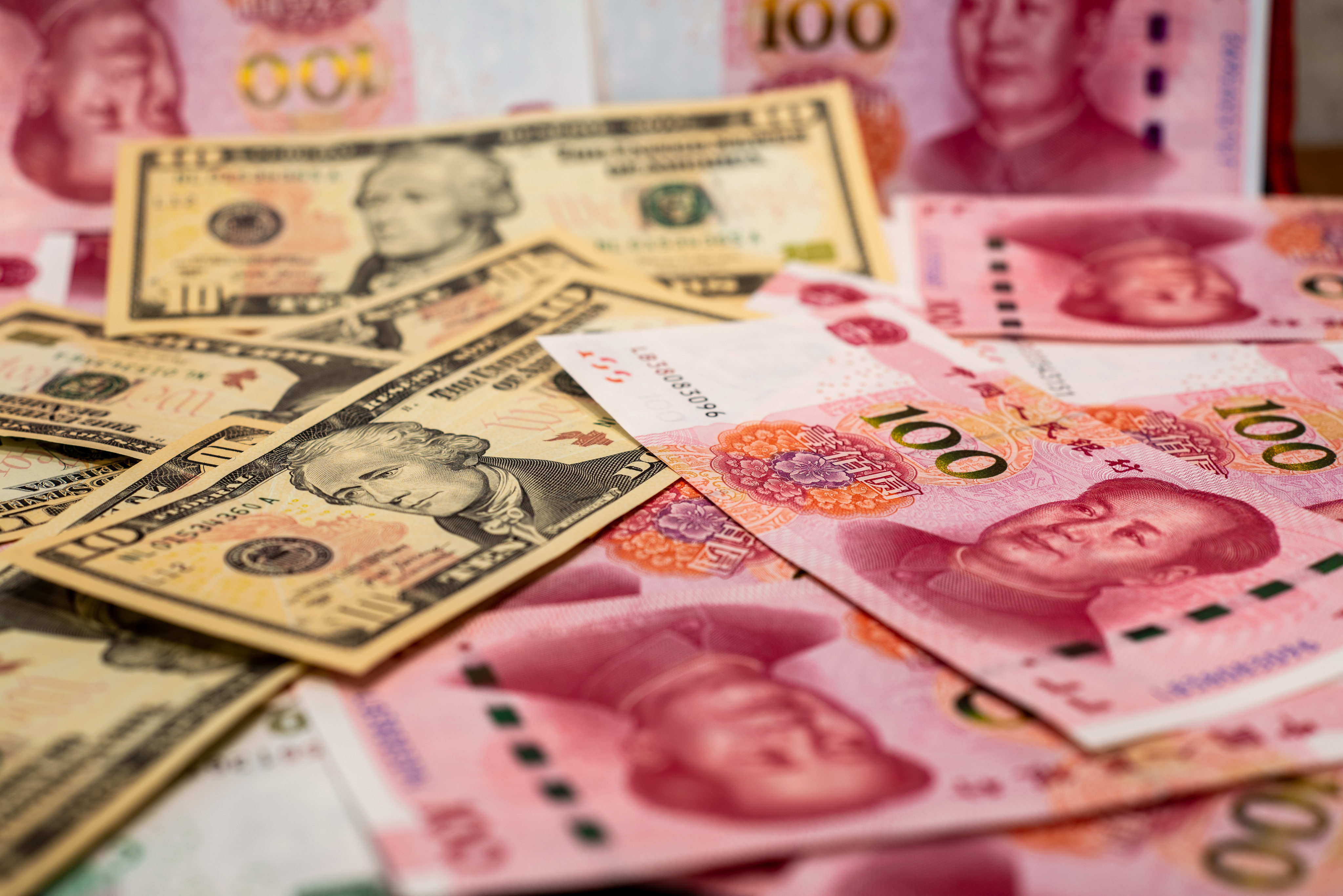 Chinese yuan and US dollar banknotes. Photo: Shutterstock