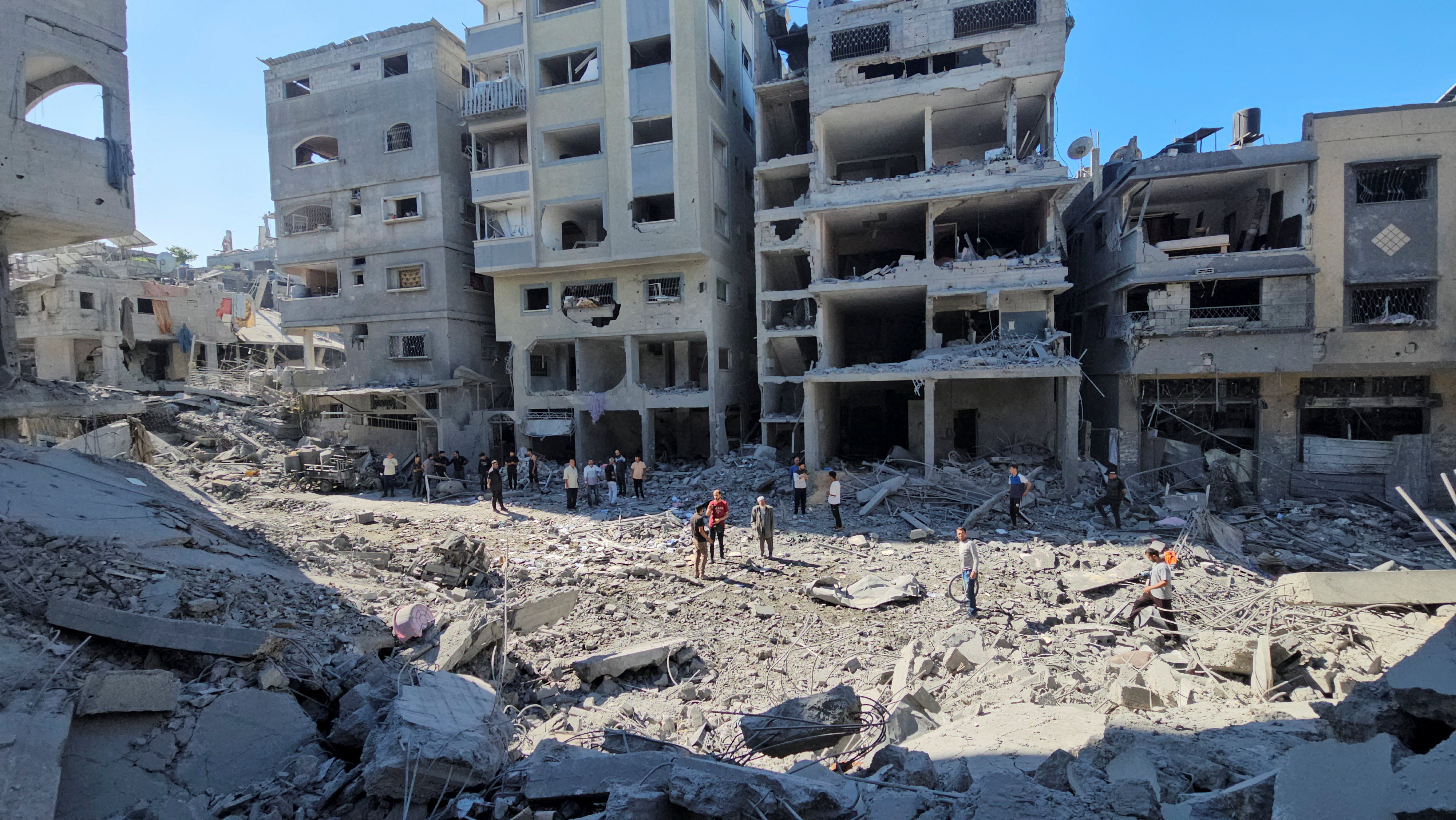 Palestinians gather at the site of Israeli strikes on houses and residential buildings in Beit Lahiya, in the northern Gaza Strip. Photo: Reuters