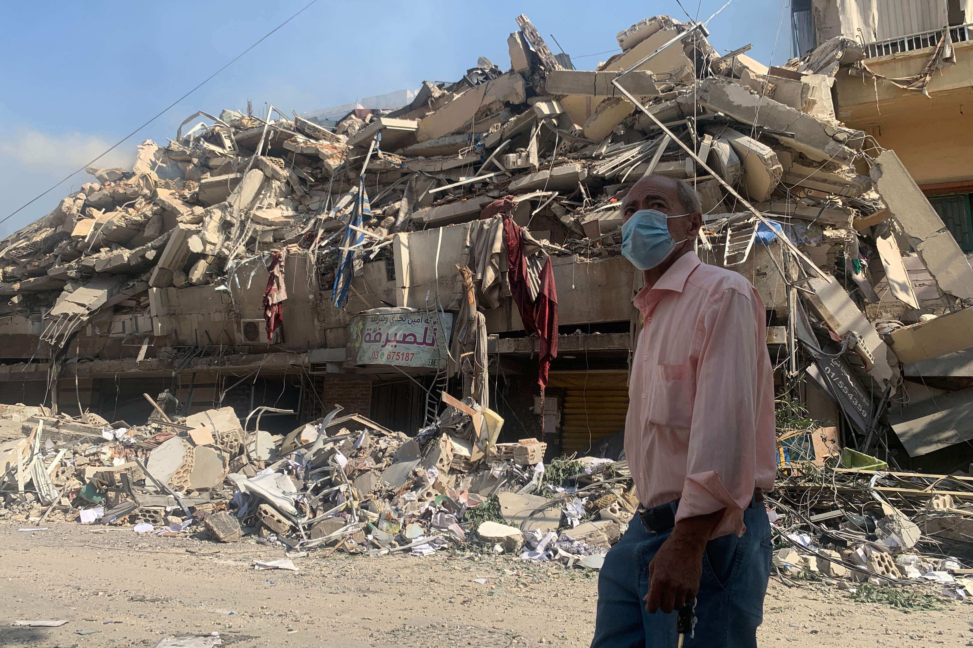 A man walks past a destroyed building in the aftermath of Israeli strikes in Beirut’s southern suburbs on November 1. Photo: AFP