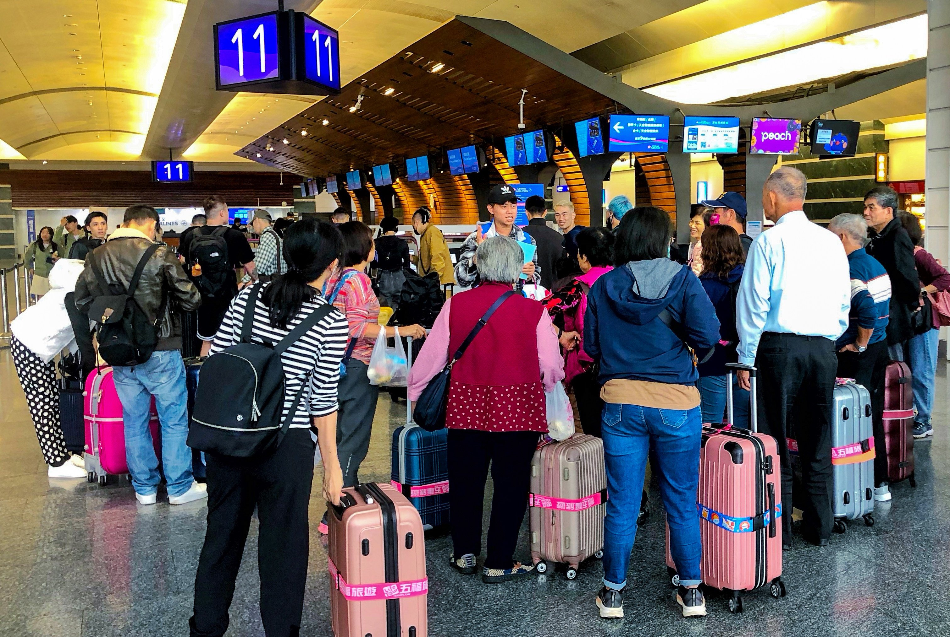 Passengers affected by flight delays caused by Typhoon Kang-rey at Taoyuan International Airport in Taiwan. Photo: CNA