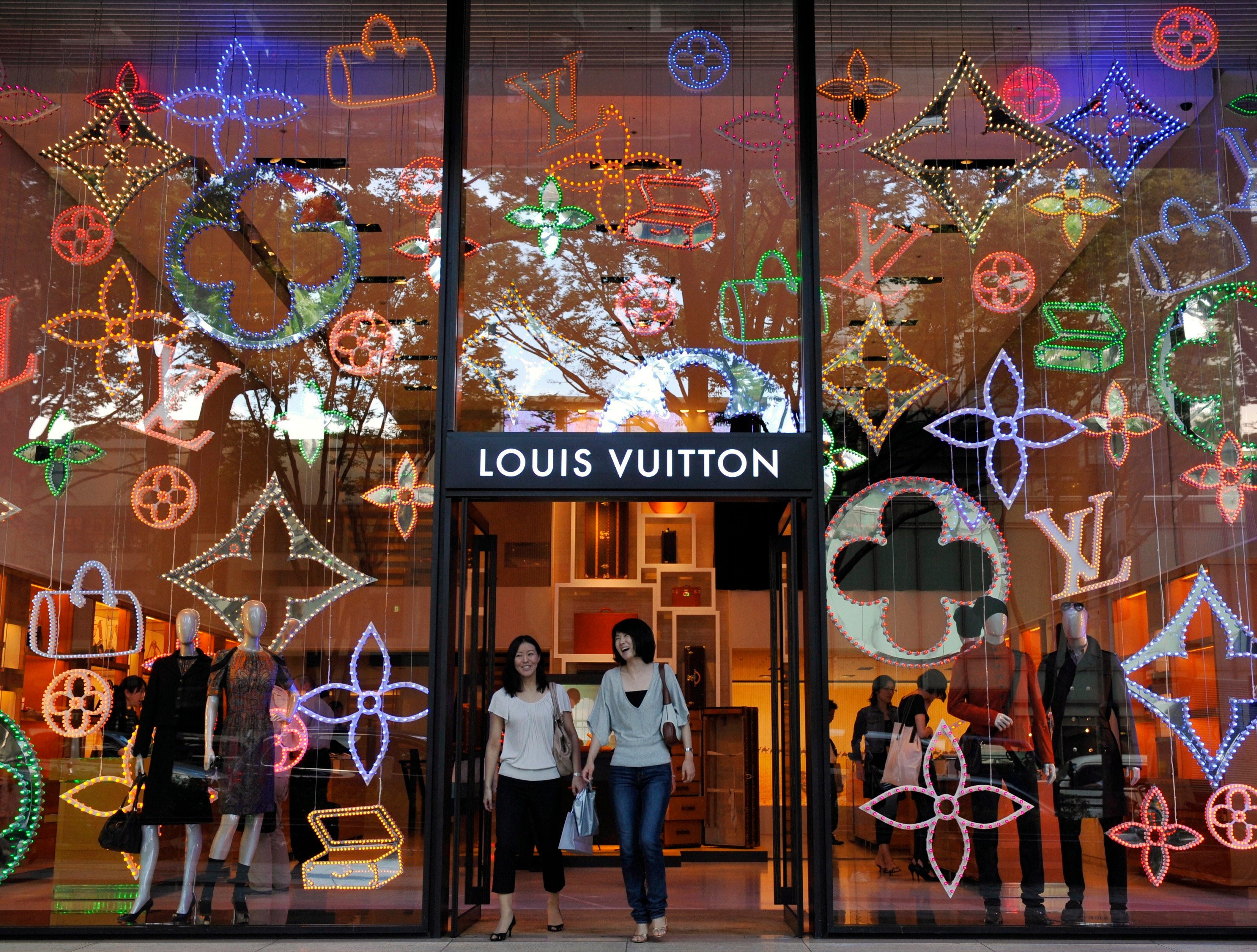 Shoppers walk out of a Louis Vuitton store in Tokyo’s Omotesando fashion district. Photo: EPA-EFE