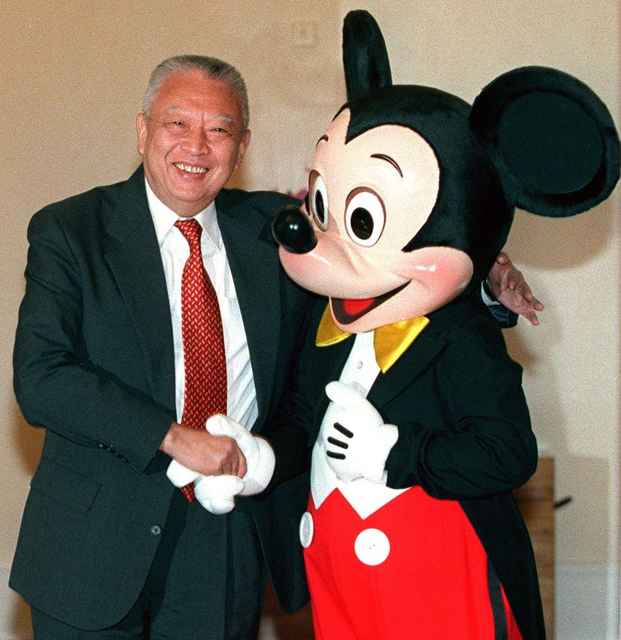 Hong Kong’s then-chief executive Tung Chee-hwa shakes hand with Mickey Mouse at Government House in 1999. Photo: SCMP