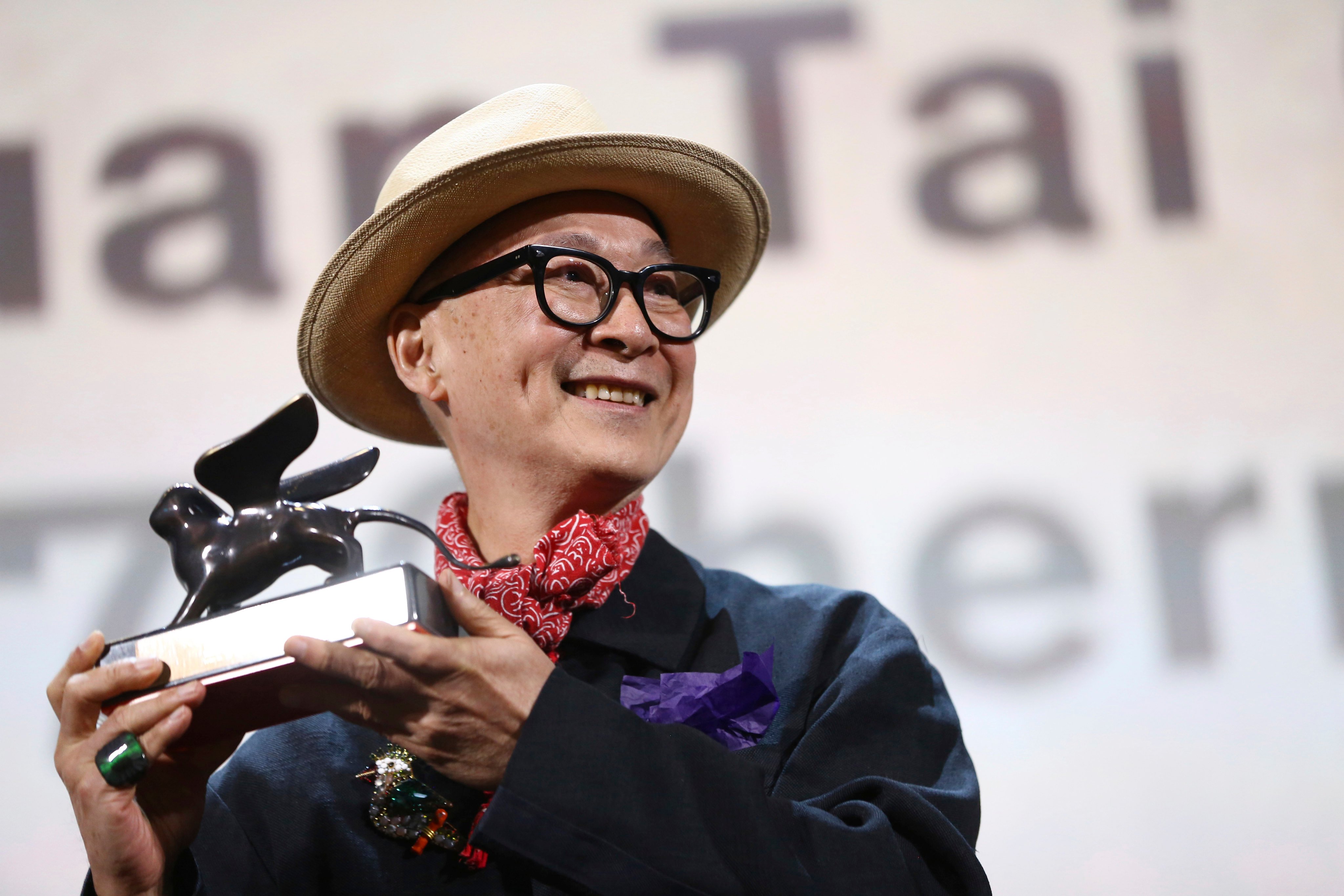 Hong Kong Director and writer Yonfan, holds the award for Best Screenplay for the film No. 7 Cherry Lane at the closing ceremony of the Venice Film Festival in 2019. Photo: AP