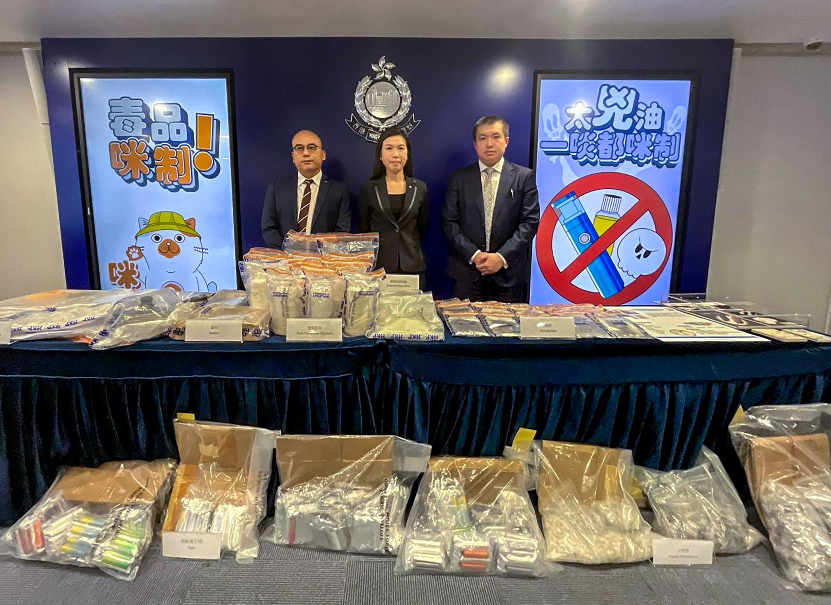 (From left) Narcotics bureau Acting Superintendent Charm Yiu-kwong, bureau Chief Superintendent Ng Wing-sze and Toxicology Reference Laboratory consultant Dr Chong Yeow-kuan with evidence seized in the latest “space oil” arrest. Photo: Handout