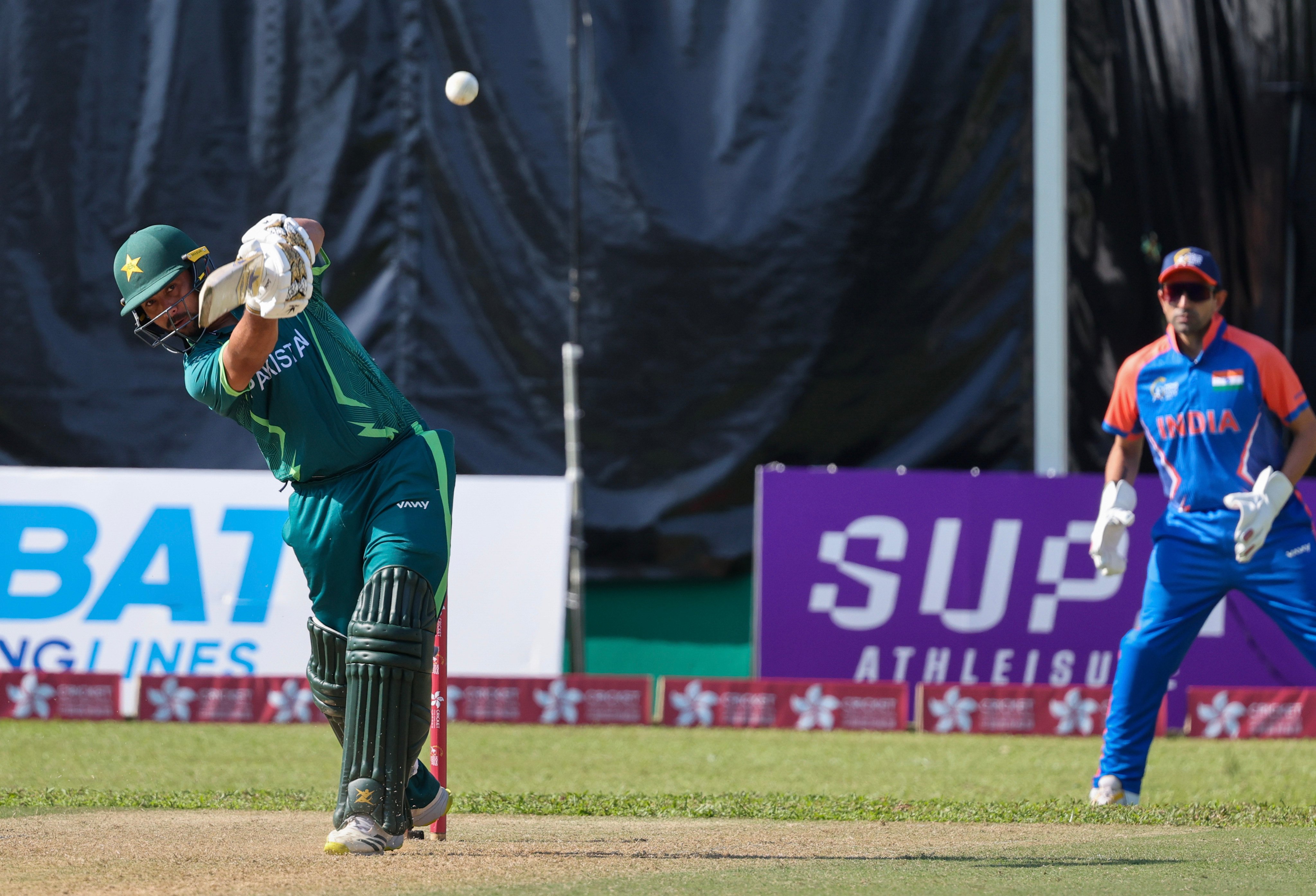 Pakistan’s Muhammad Akhlaq (left) batting against India at the Hong Kong Sixes on Friday. Photo: Dickson Lee