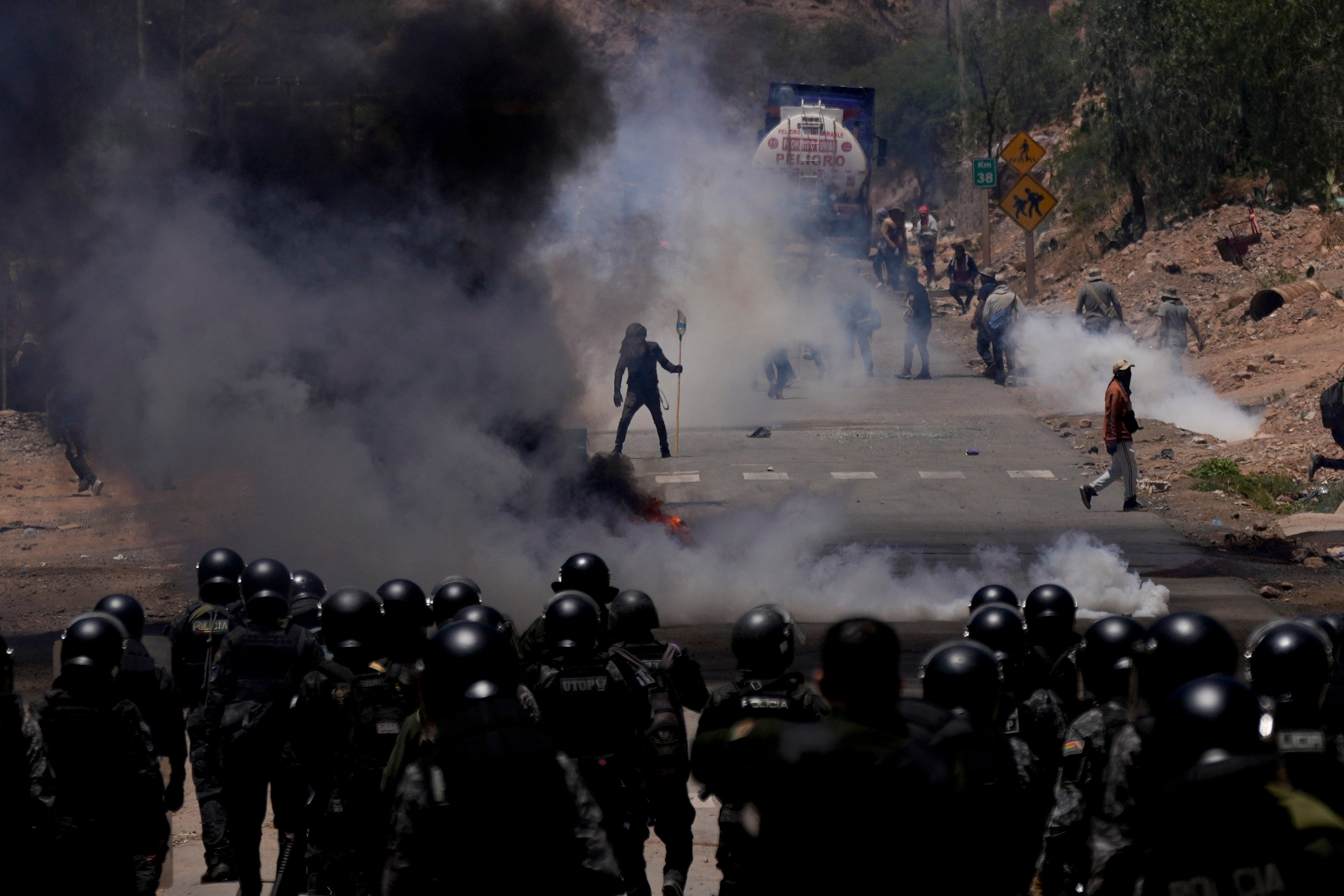 Police launch tear gas to disperse supporters of former president Evo Morales in Parotani, Bolivia, on Friday. Photo: AP