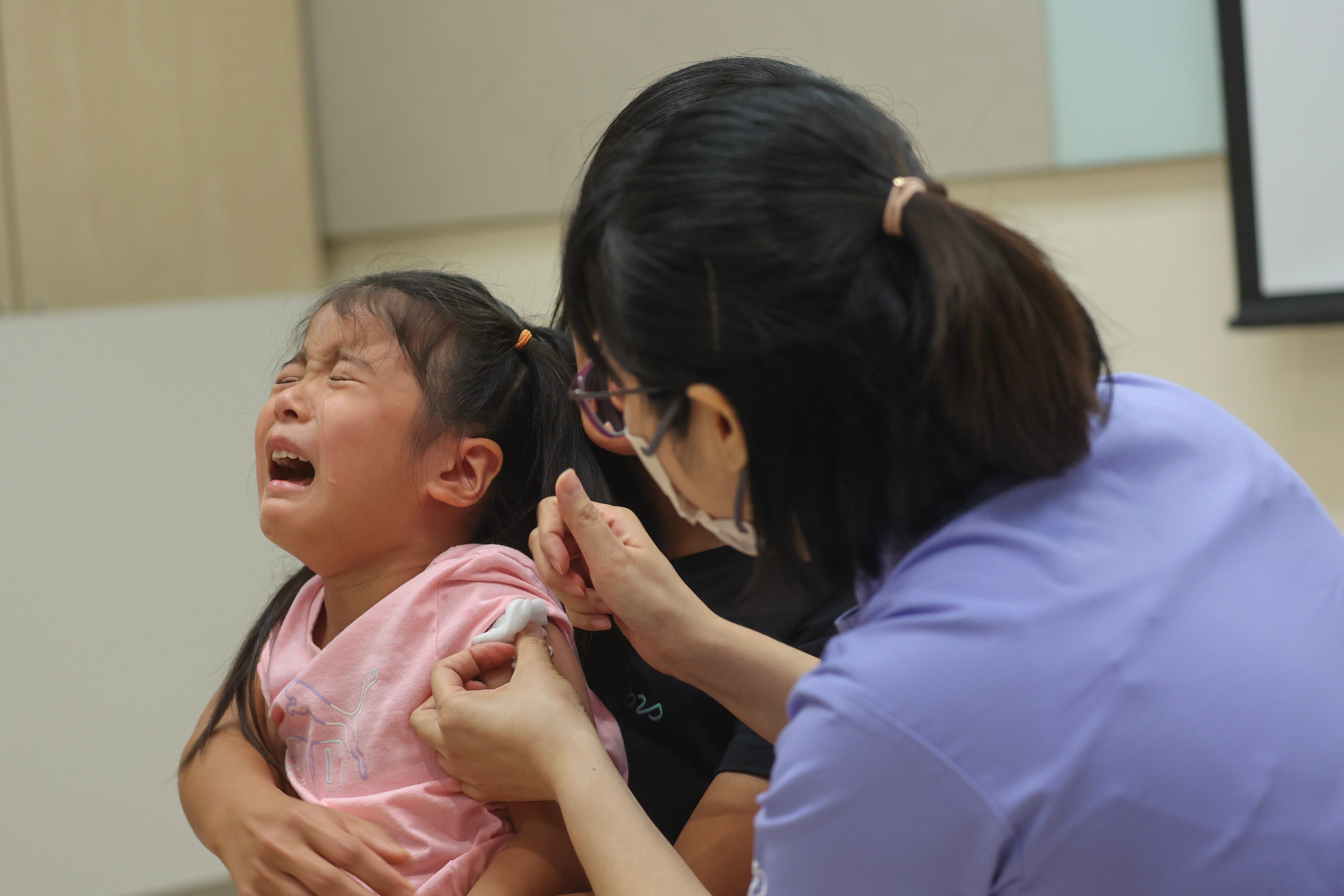 Parents may feel children are too young to be vaccinated against Covid and flu. But there have long been childhood immunisation schemes against diseases for different age groups. Photo: Edmond So