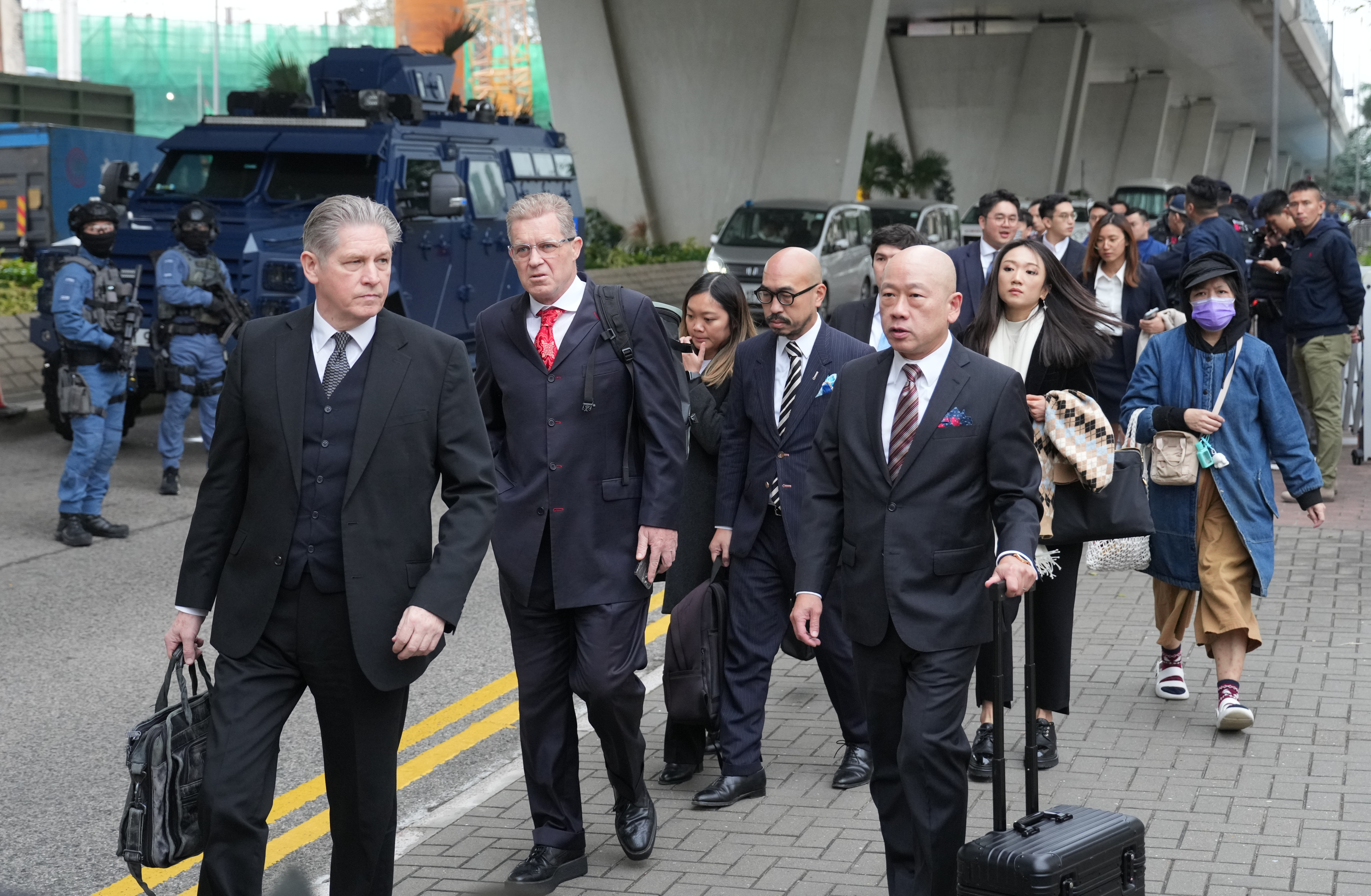 Lawyers of tycoon Jimmy Lai Chee-ying leave the West Kowloon Court on December 18, 2023, following a hearing on Lai’s sedition and conspiracy charges in connection with the 2019 anti-government protests. File photo: Sam Tsang