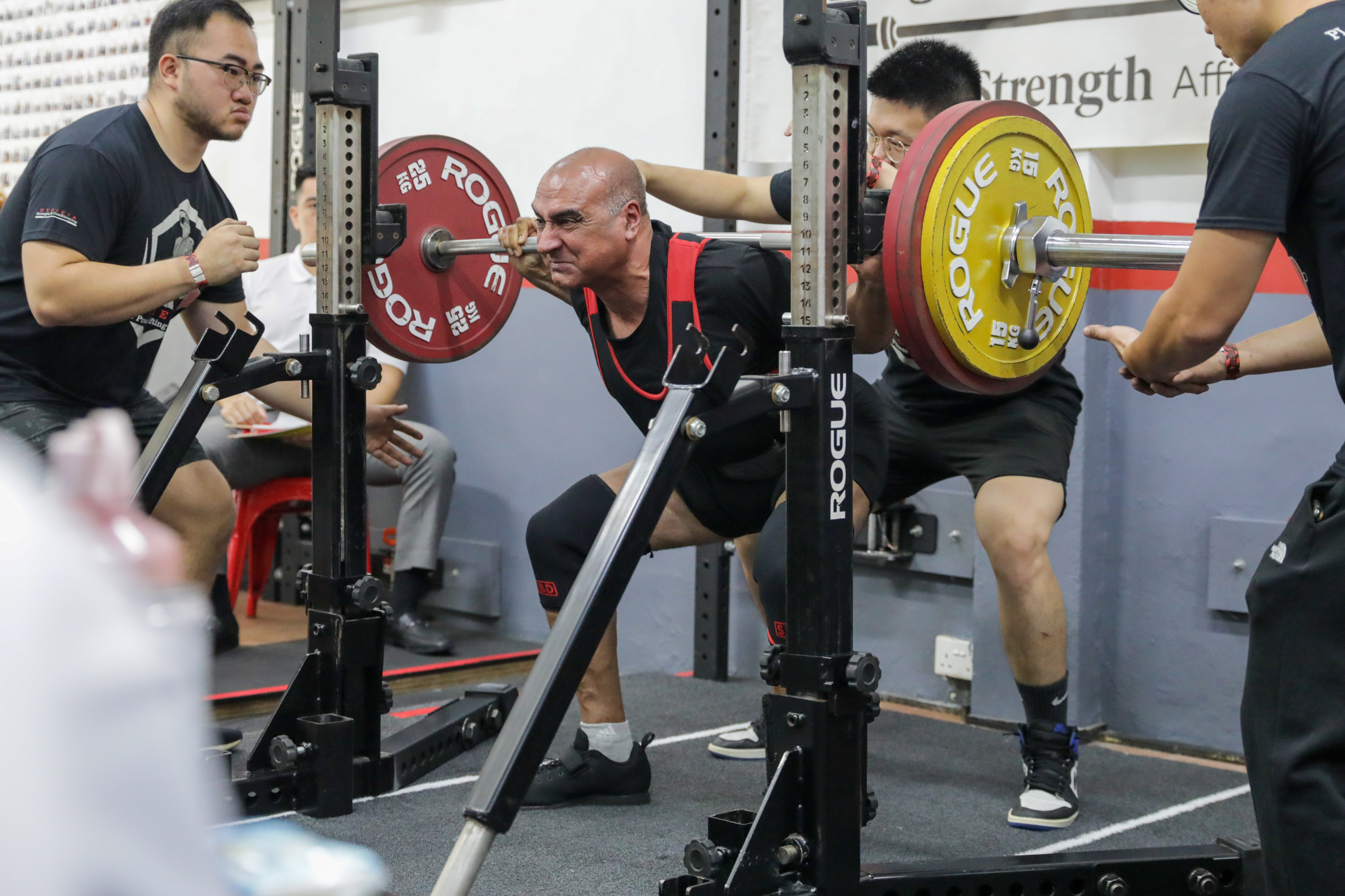 When Raj Grover developed severe back pain, he hit upon a surprising remedy: lifting weights. Here he is seen squat lifting 155kg. Photo: Shaun Pang