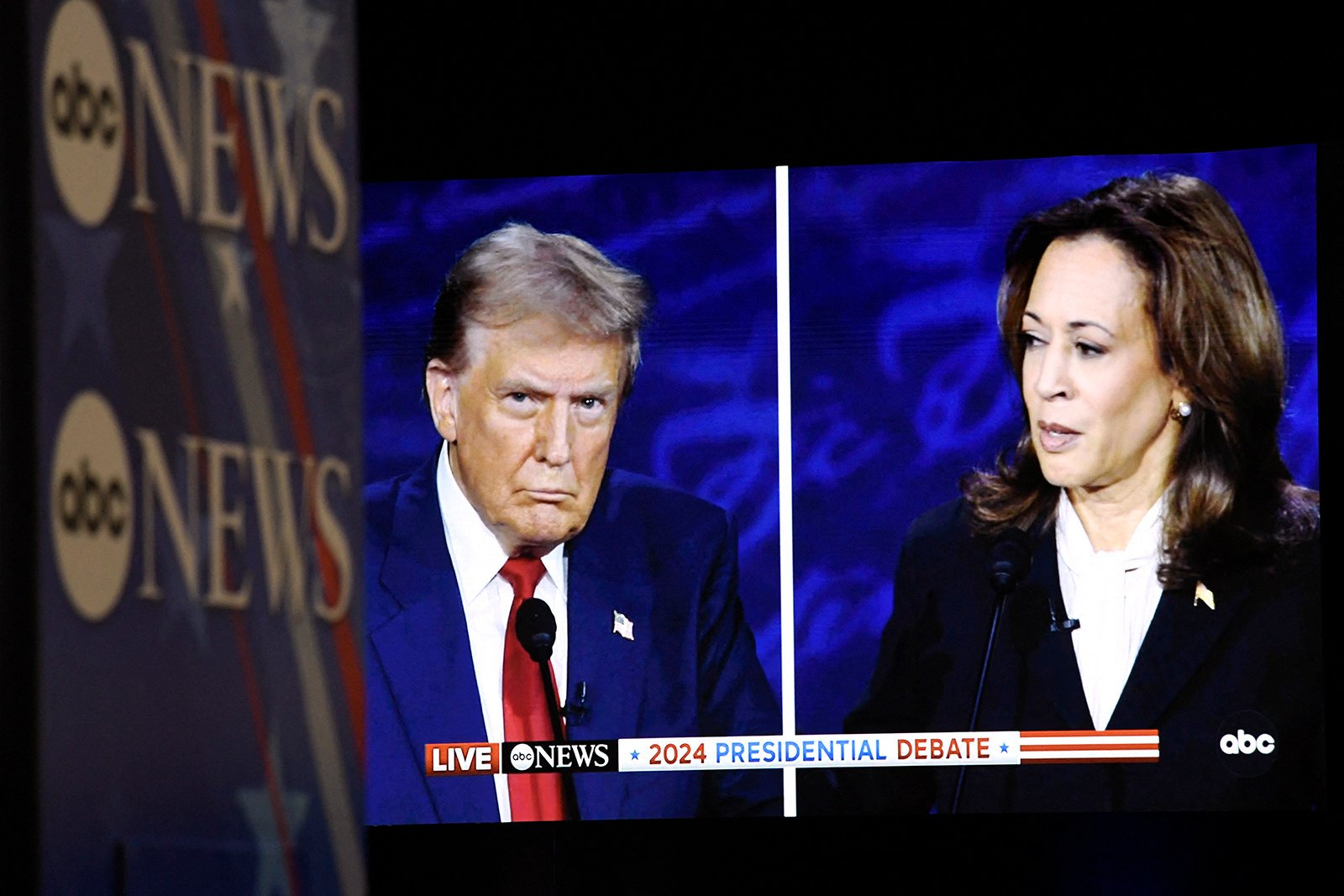 US Vice-President and Democratic presidential candidate Kamala Harris and former US president and Republican presidential candidate Donald Trump are seen on a screen as they participate in a presidential debate at the National Constitution Center in Philadelphia. Photo: TNS