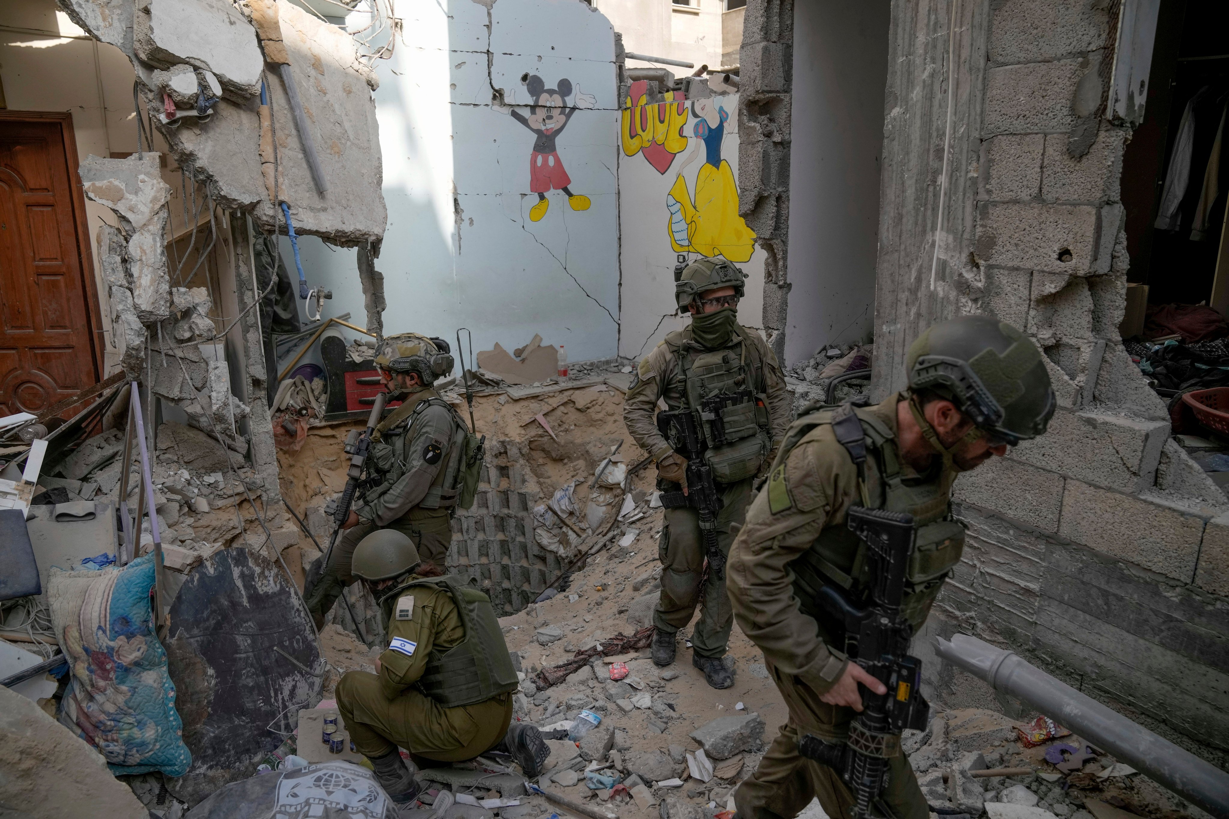 Israeli soldiers at the entrance of a tunnel in the southern Gaza Strip where the military says six hostages were killed by Hamas militants. File photo: AP